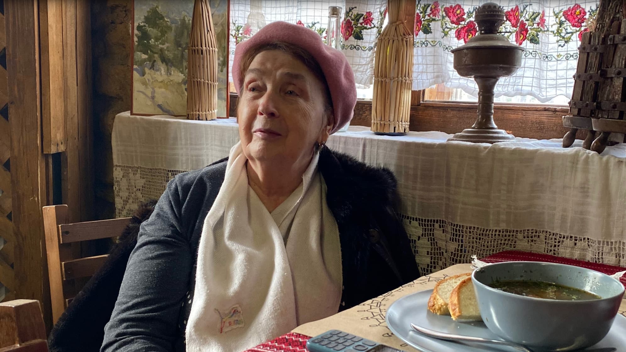 Natalya, a 70-year-old retired epidemiologist from Odessa, has lunch at the Asconi Winery near Chisinau, in Moldova, where she is being hosted for free.