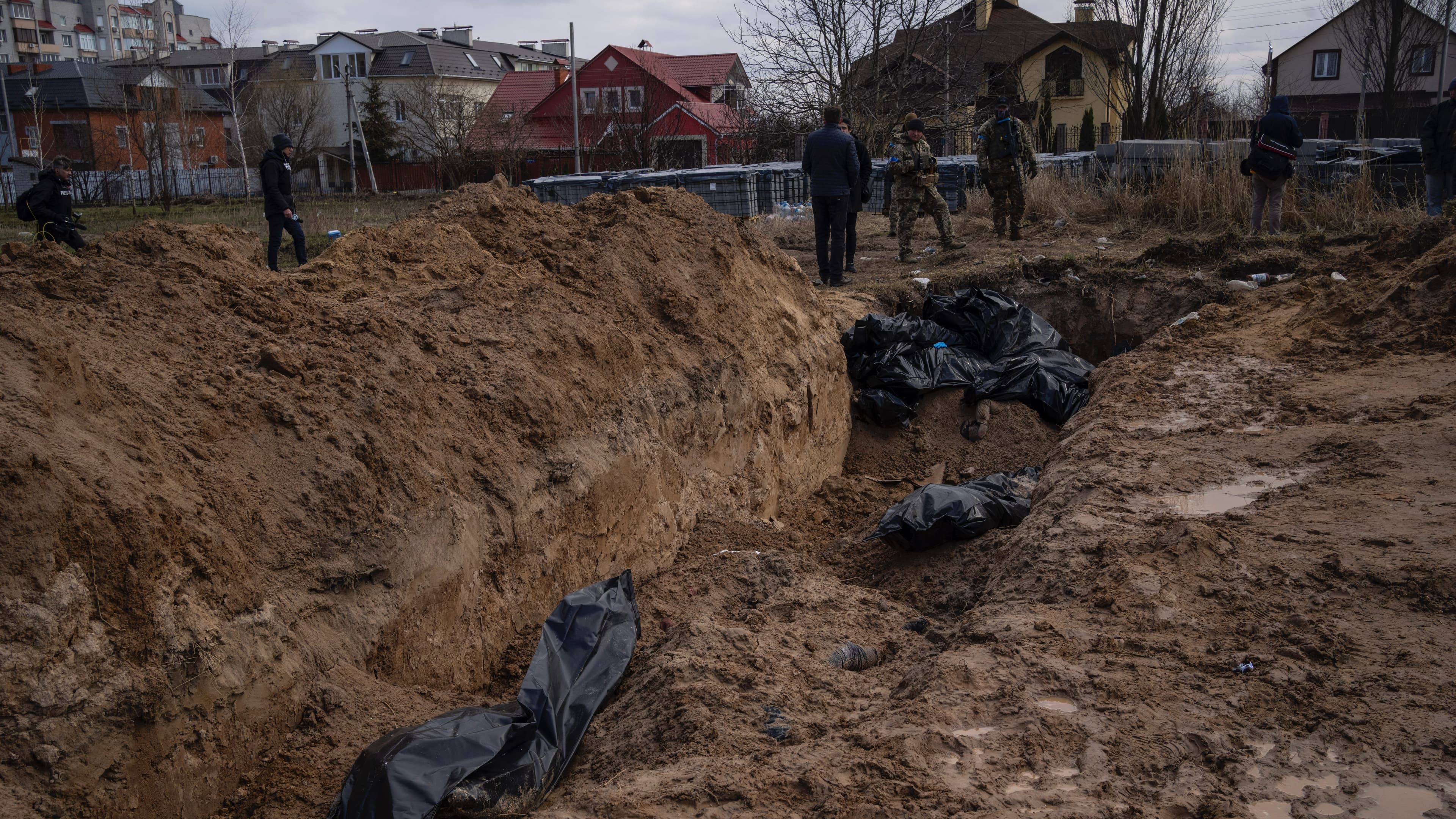 mass grave with bodies
