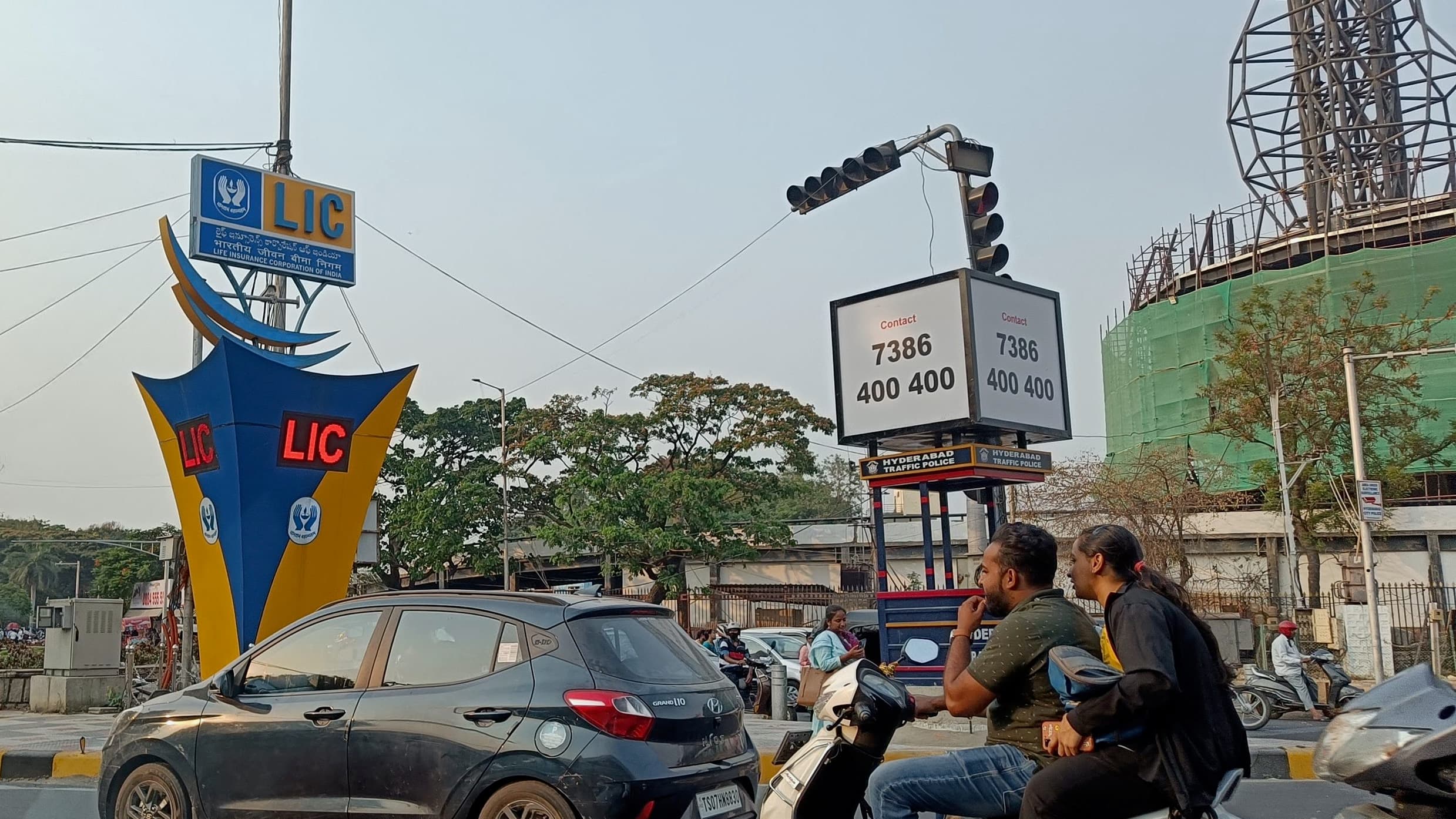 The blue and yellow LIC logo is seen on a traffic island in Hyderabad in southern India. The government-owned company is India's biggest insurer. Its upcoming IPO is set to be India's largest ever.