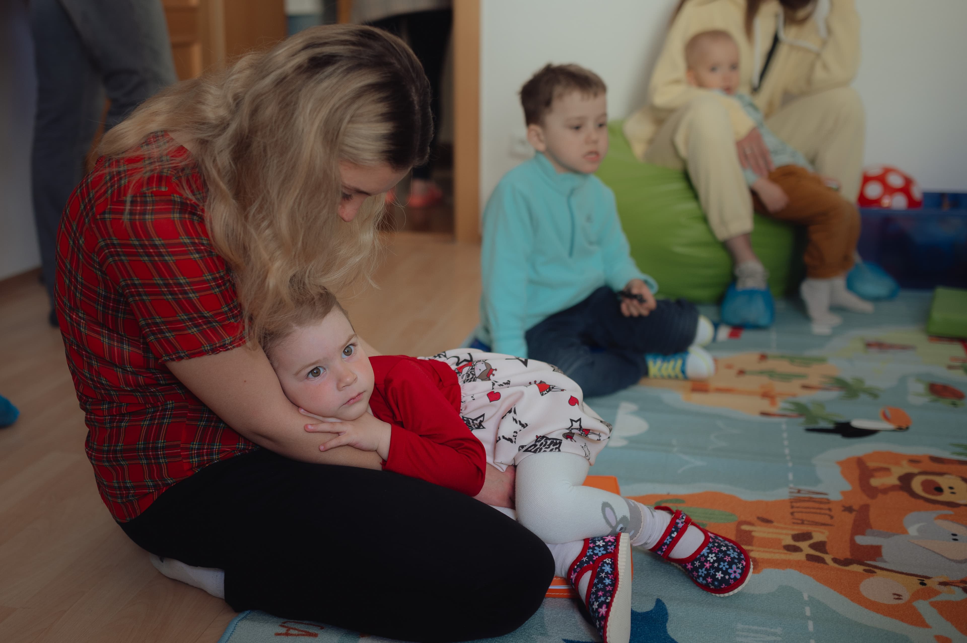 A Ukrainian refugee and her 3-year-old daughter play in a new day care for refugees in Slovakia.