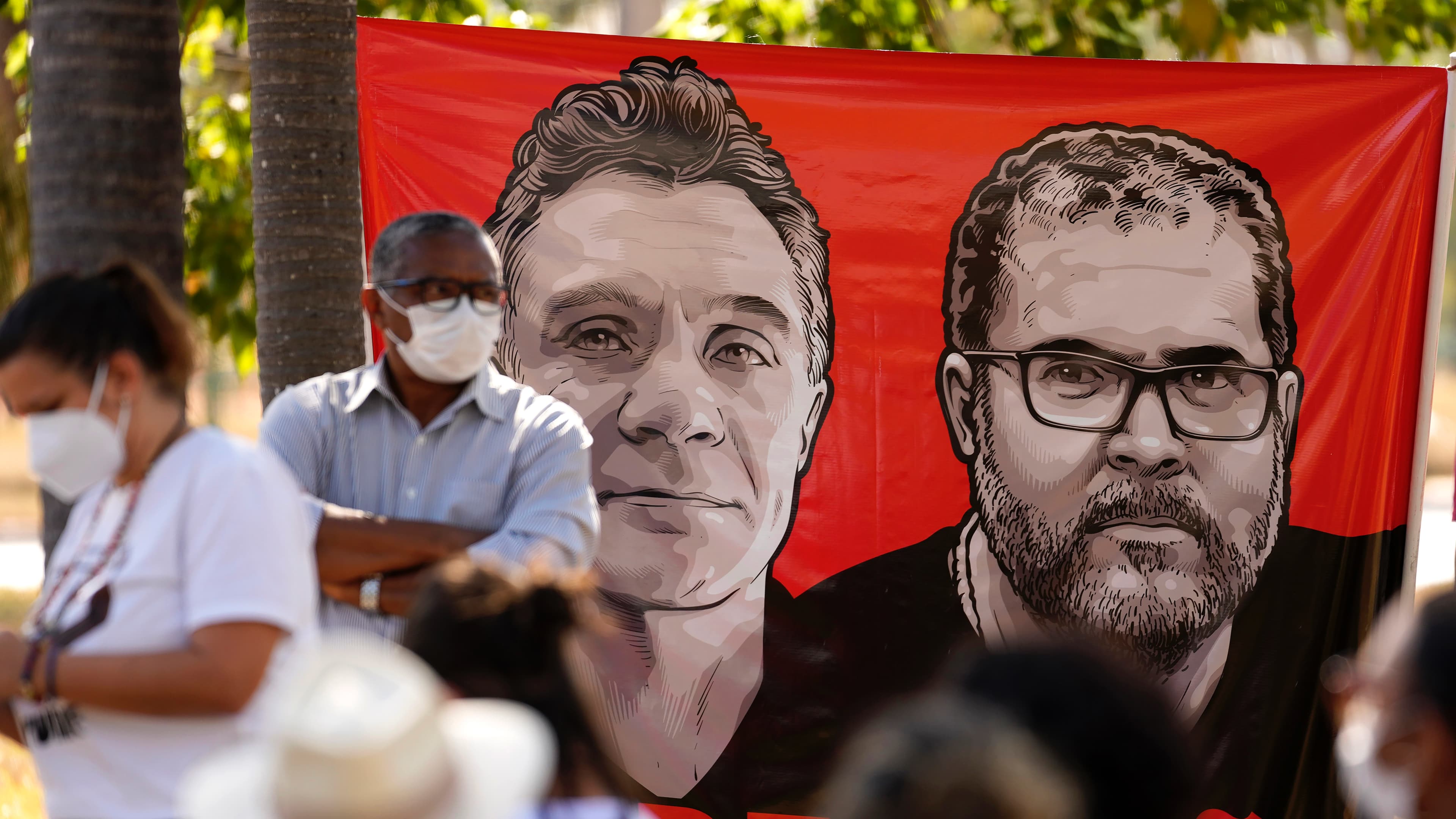 banner with people in front of it