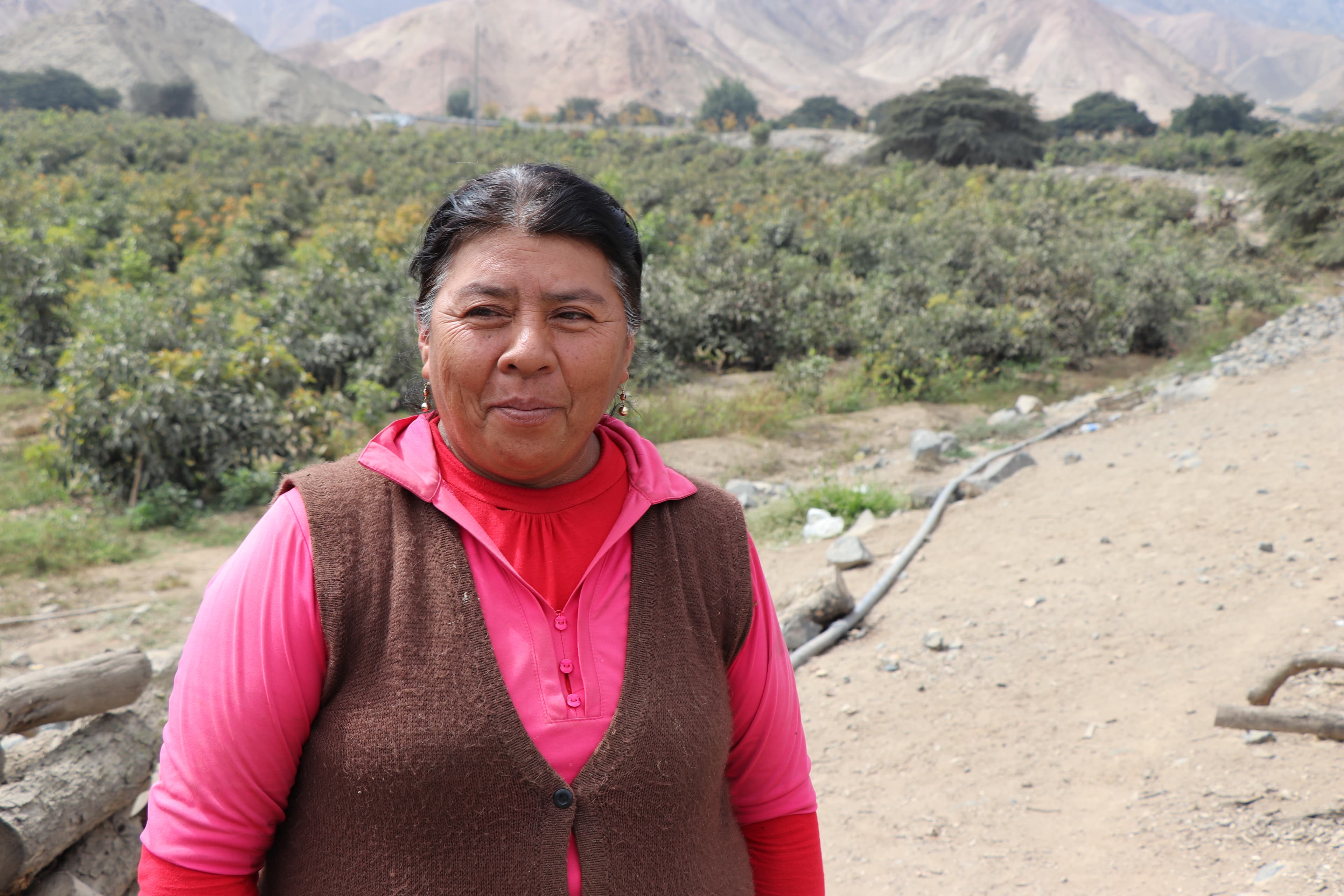 farmer standing near trees