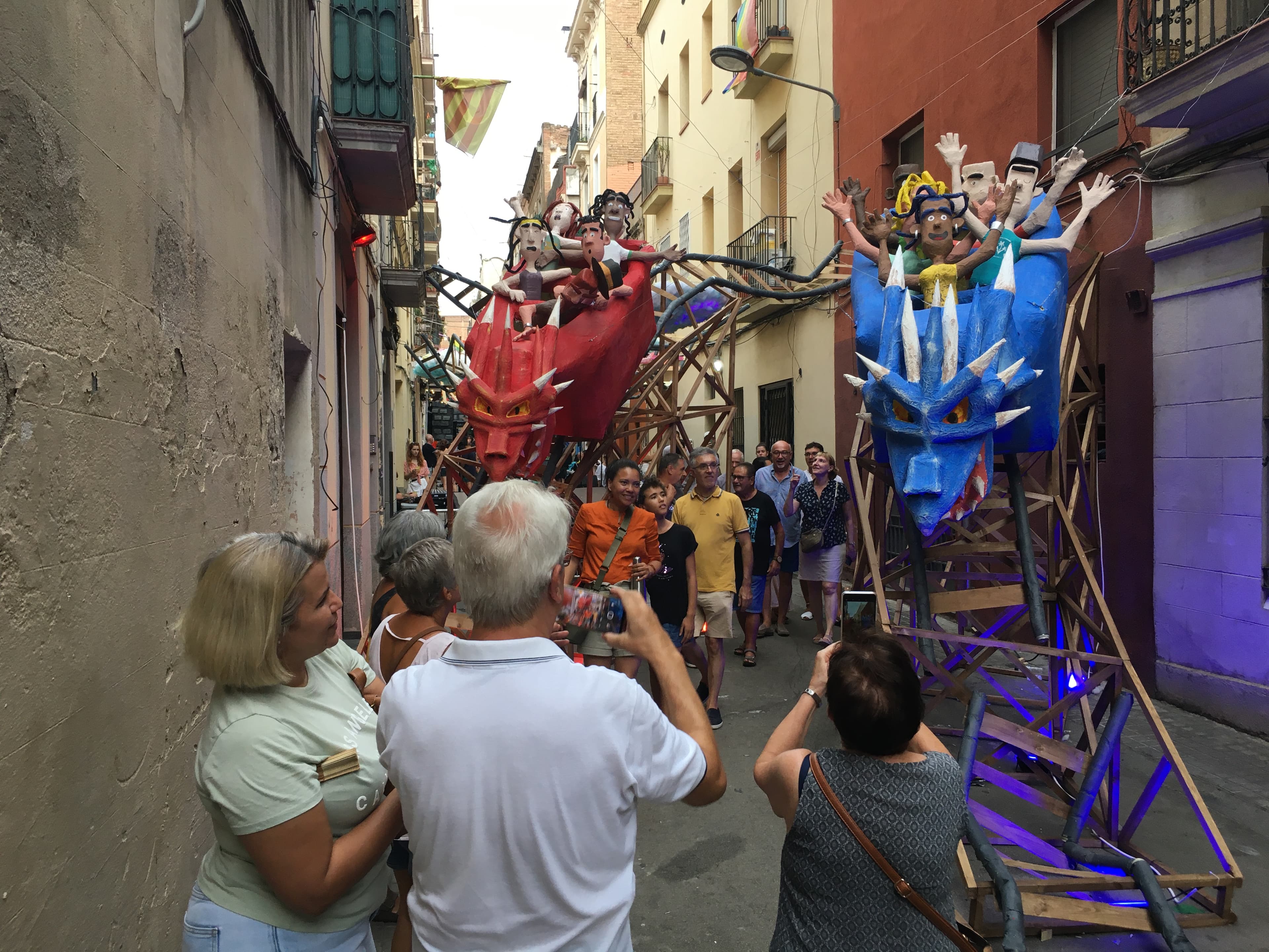 crowd with some people snapping photos