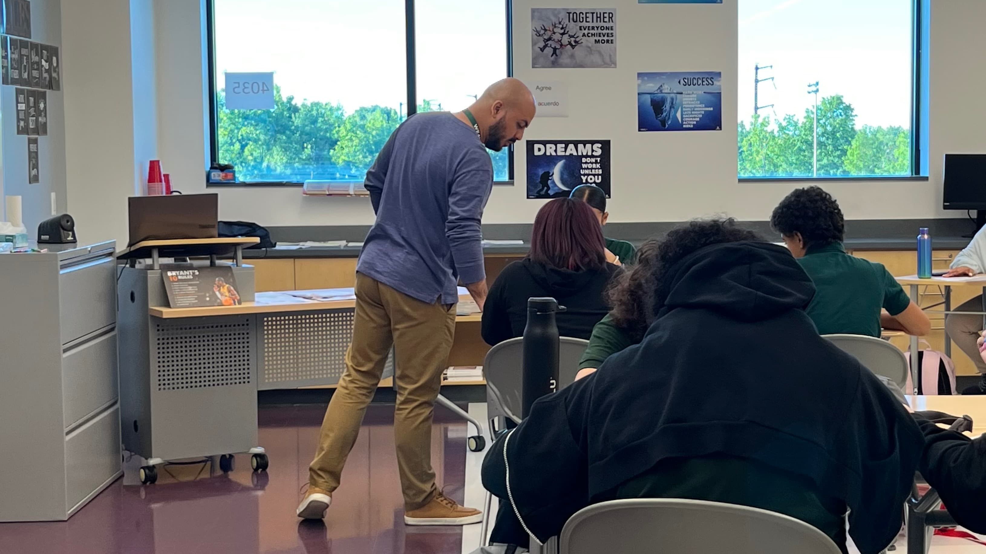 a teacher checking student work