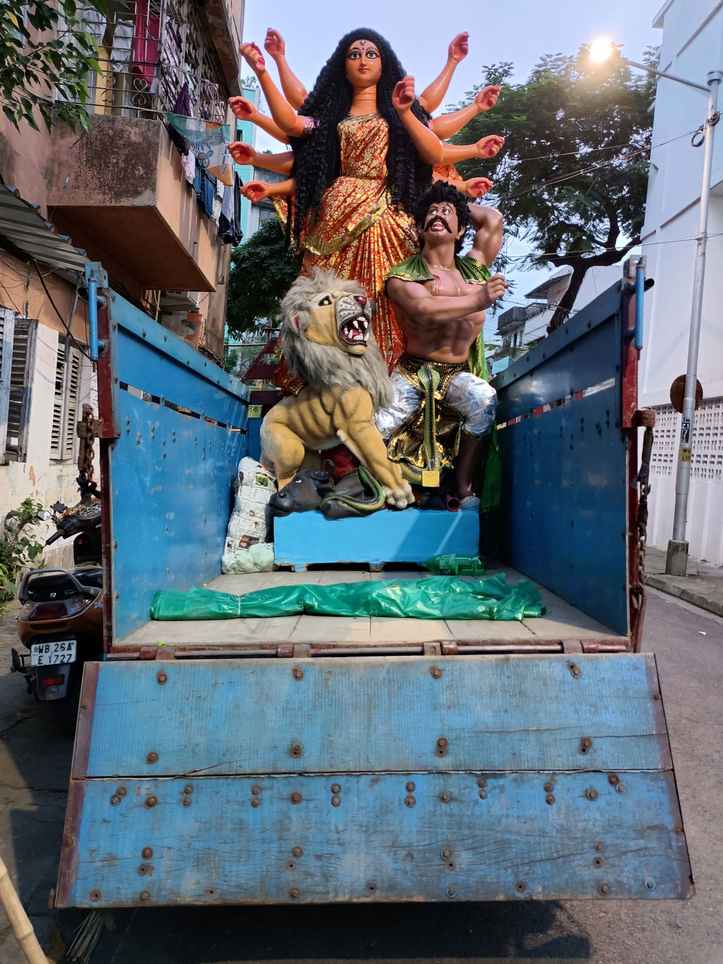 The goddess Durga riding on a truck en route to worship.