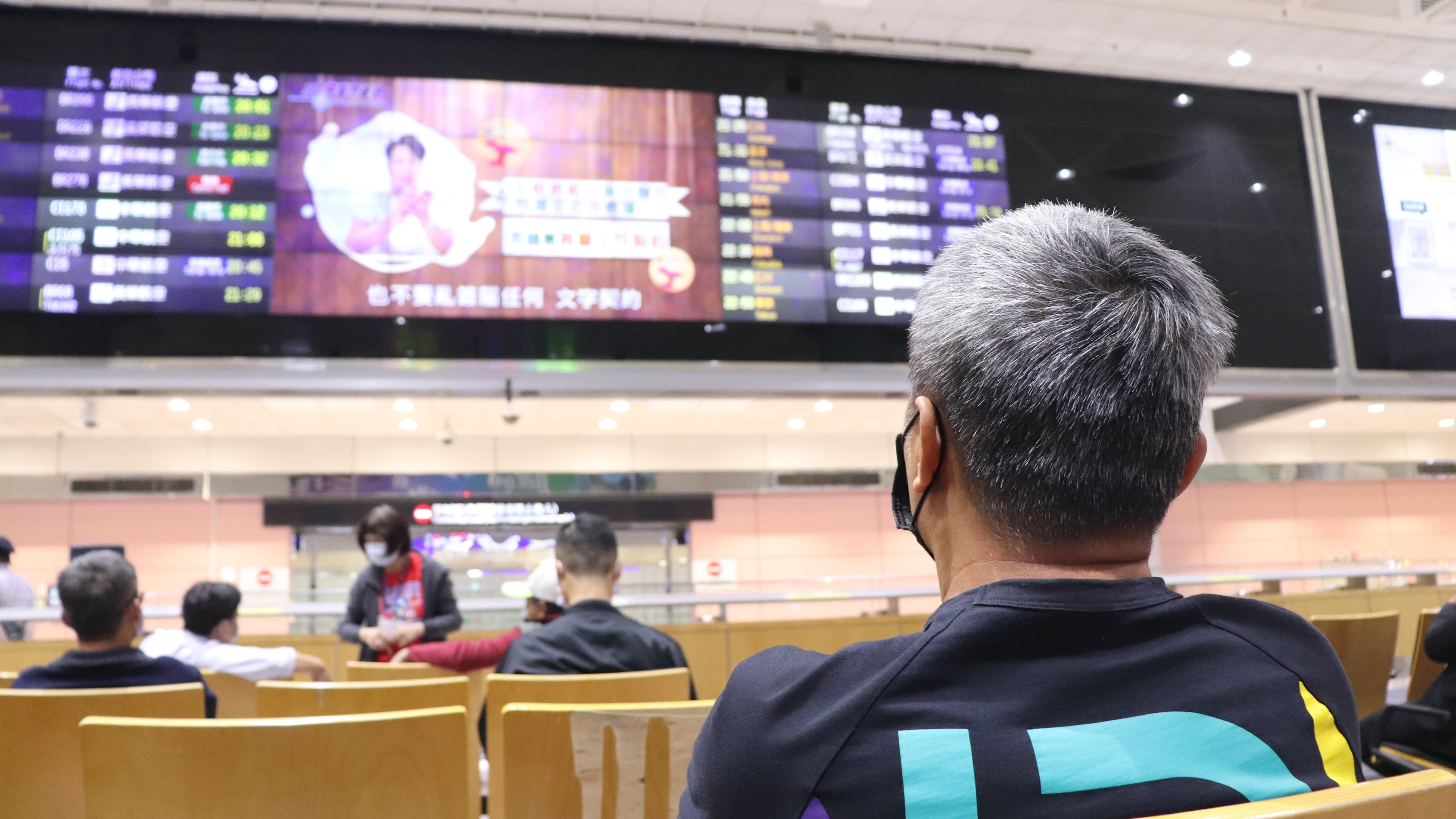 man waiting at airport