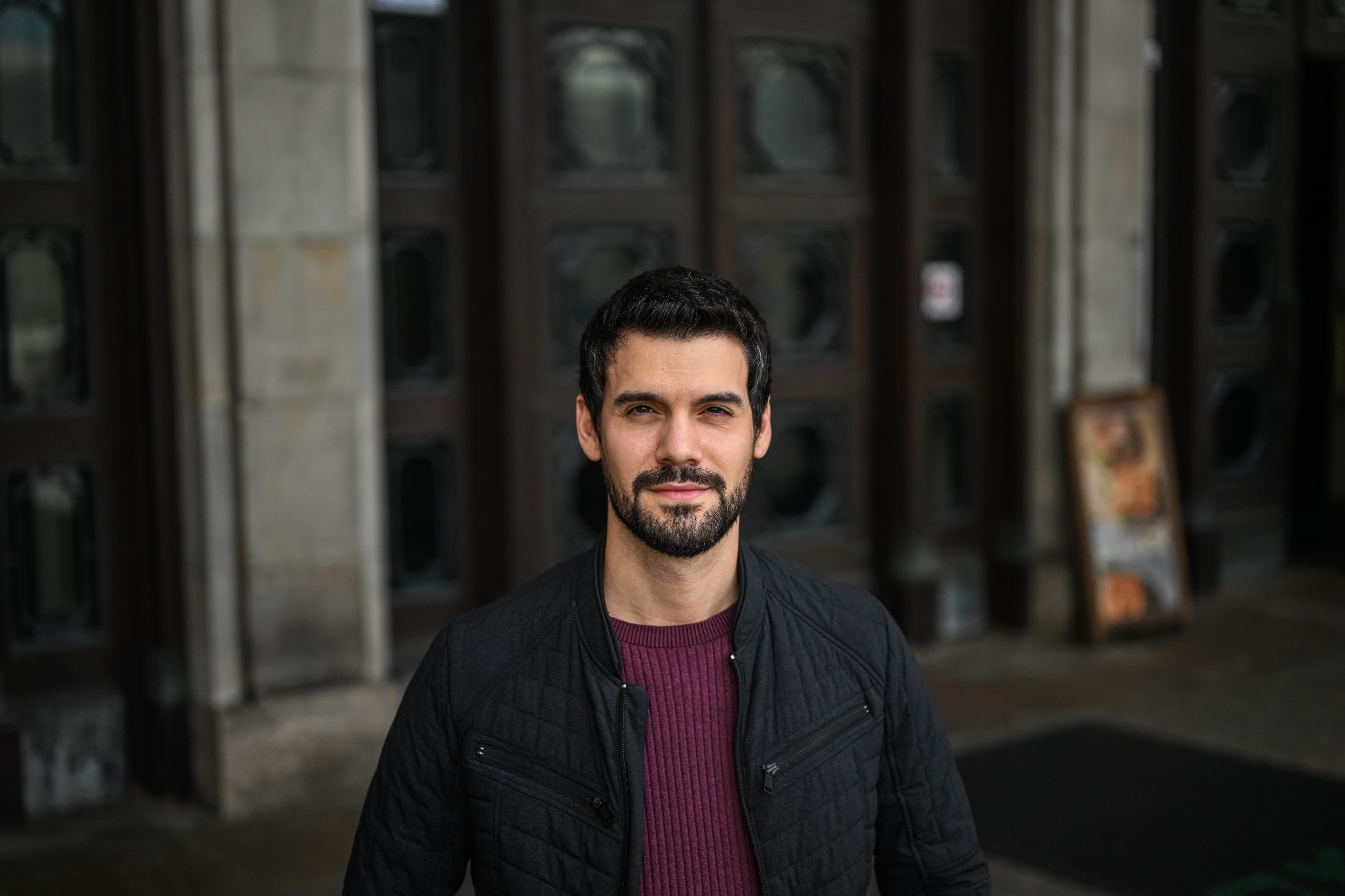 man wearing jacket inside palace