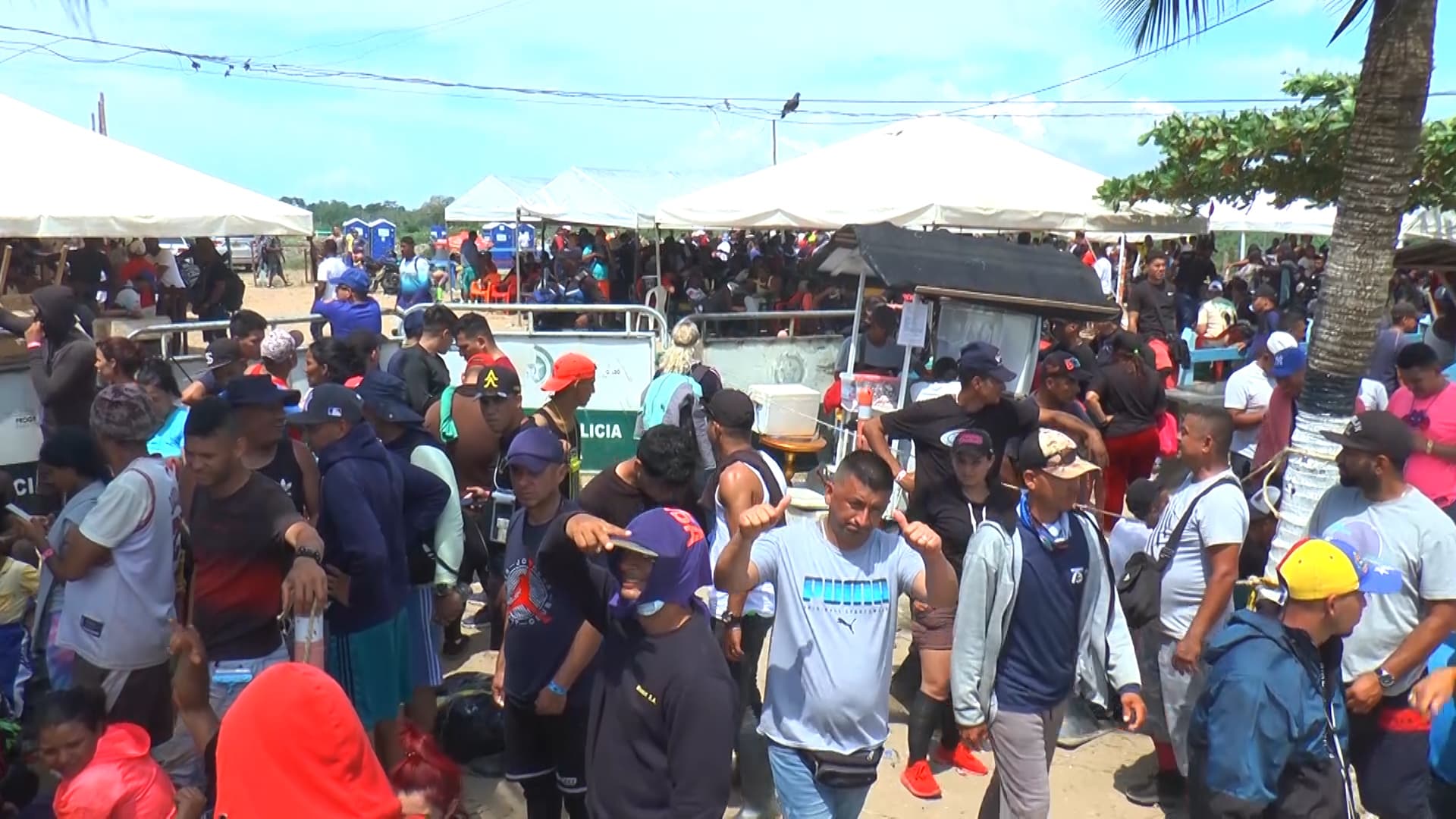 Hundreds of Venezuelan migrants wait for boats to take them towards Colombia's border with Panama