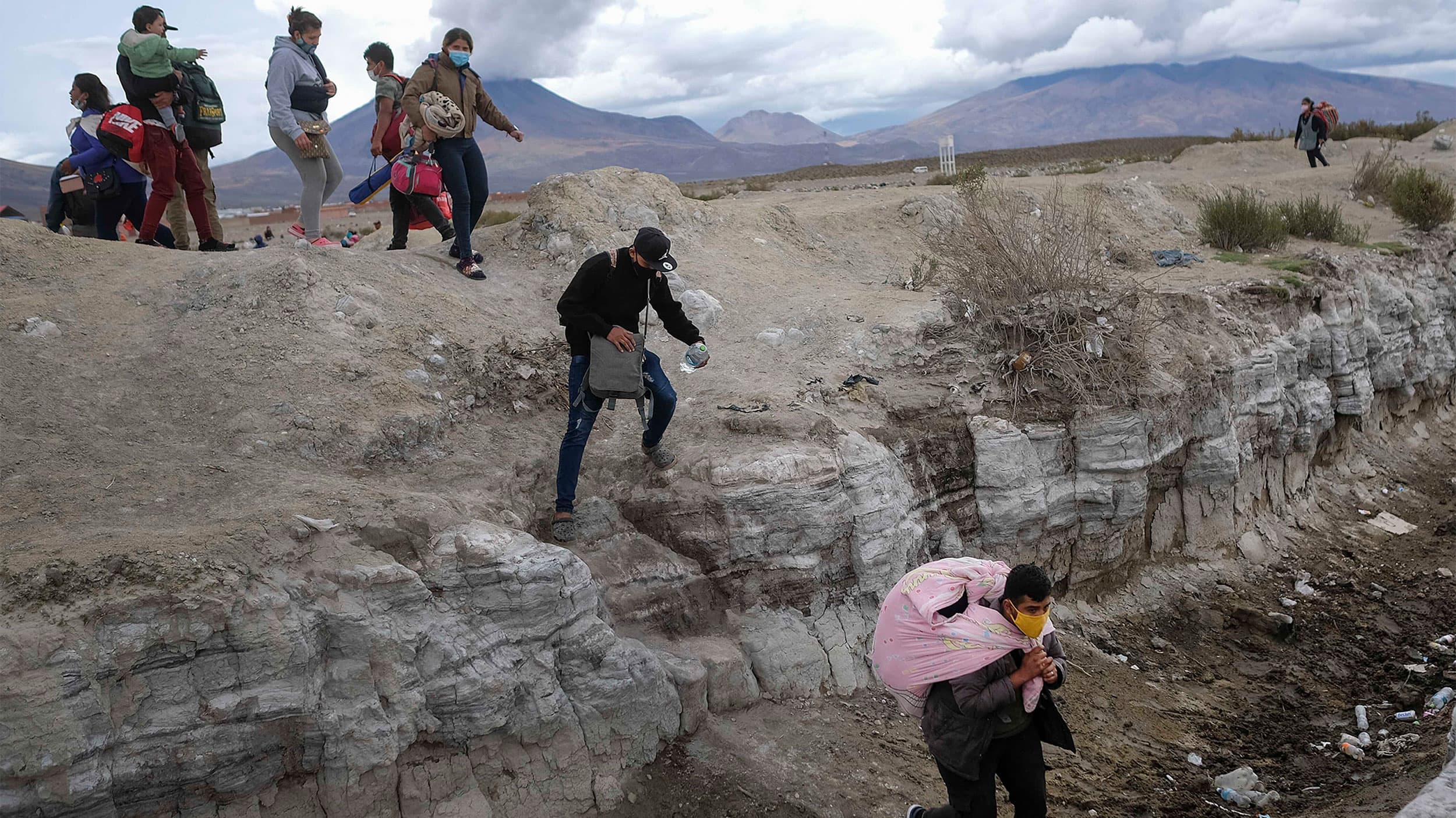 Migrants from Venezuela cross into Chile from the Bolivian border near Colchane, Chile