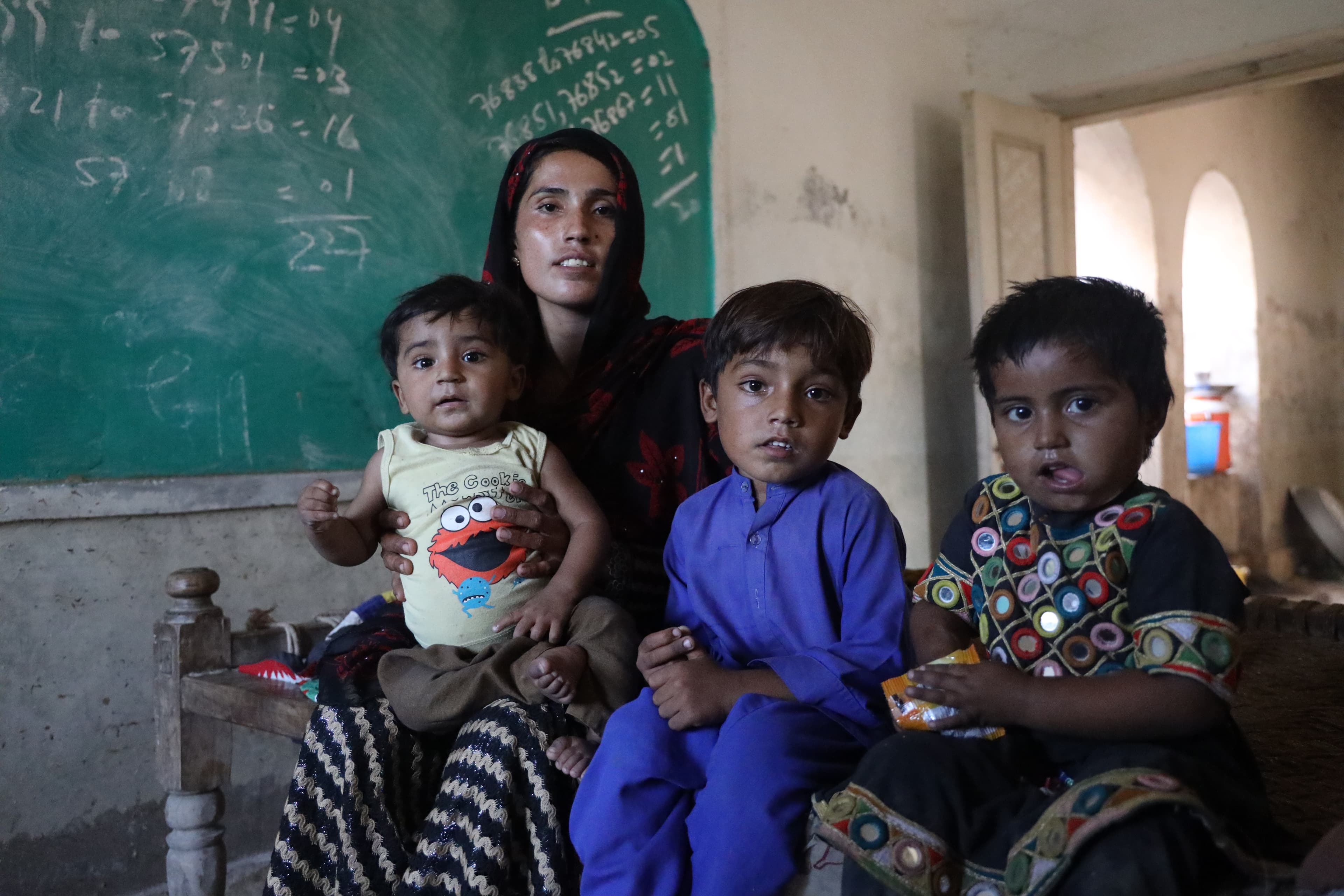 Heer Mallah with her children Zulgar Non, 5, Zakia, 3, and Aurong Zeb, 1.