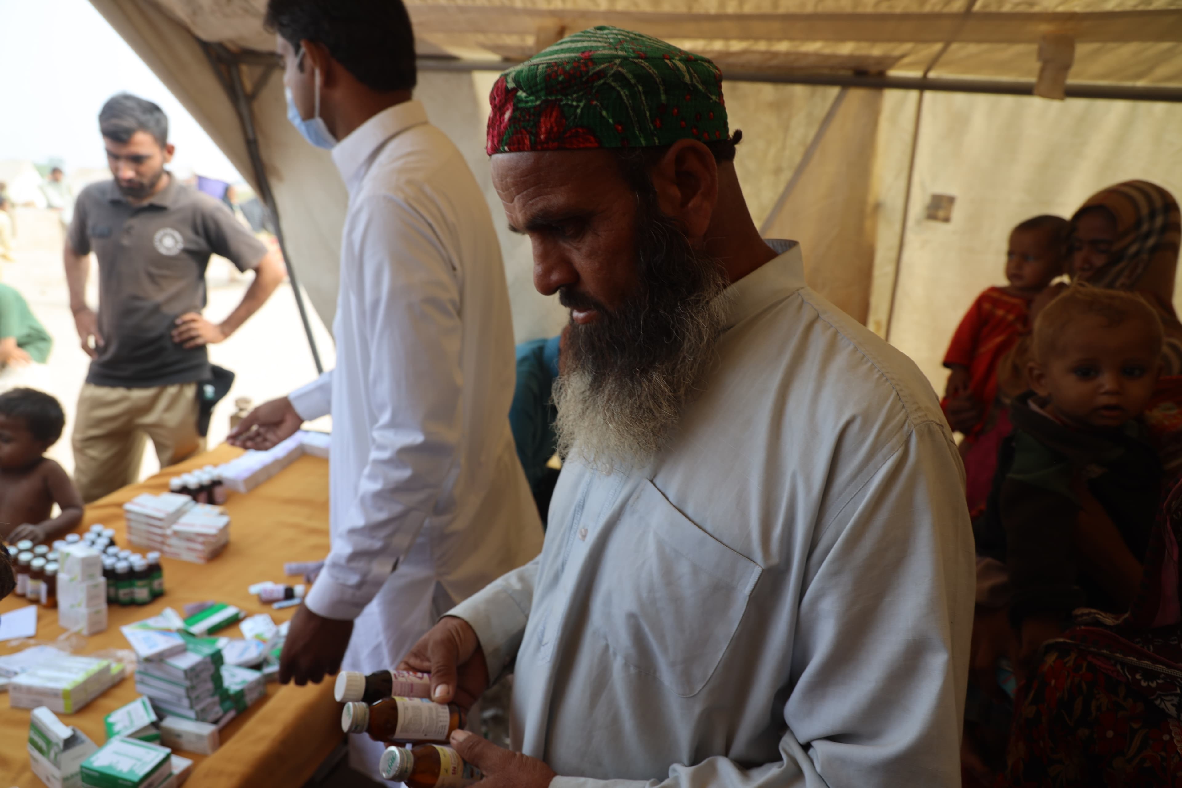 man looking at medicines