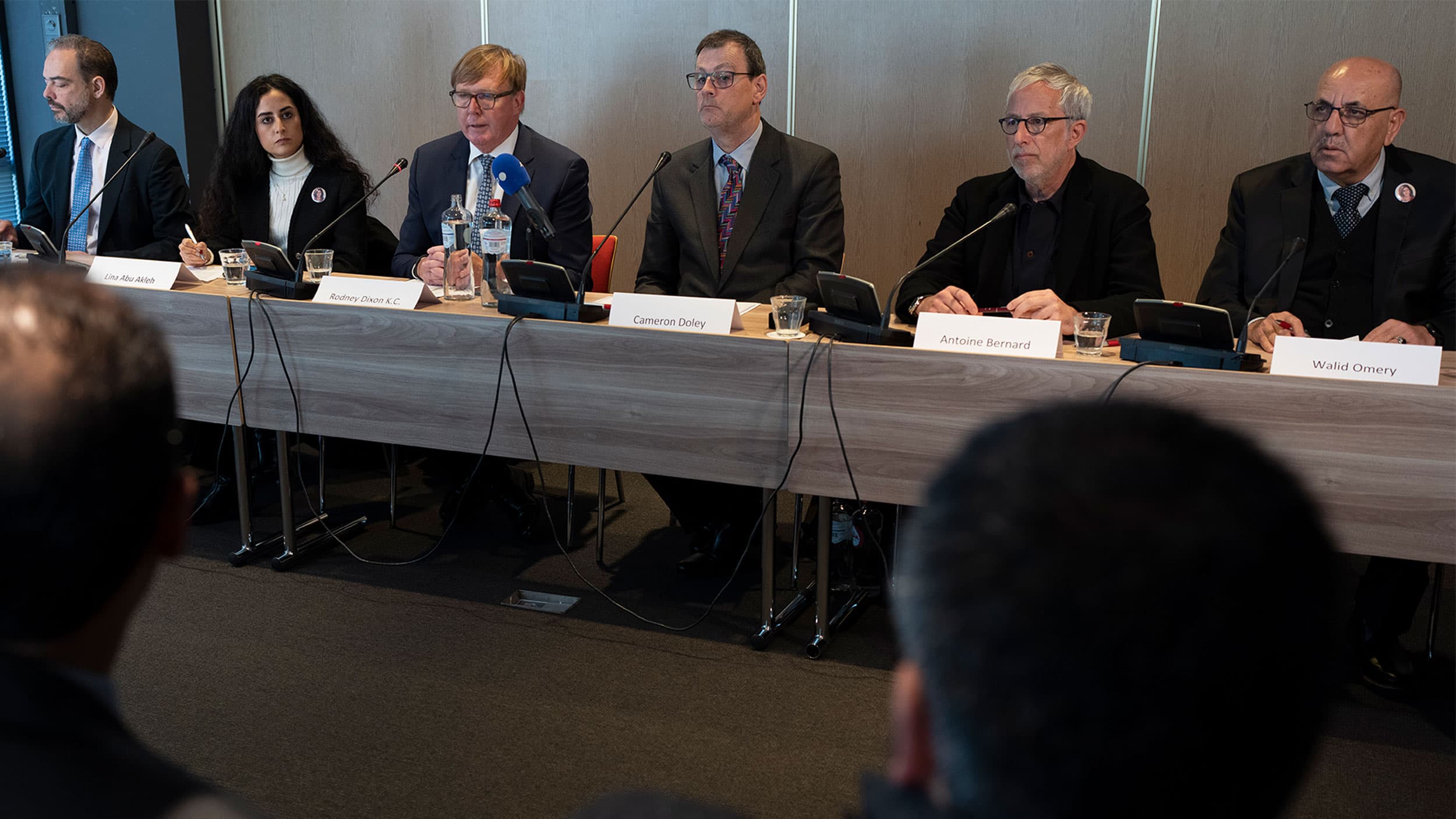 Rodney Dixon, lawyer for Al Jazeera, third from left, and Lina Abu Akleh, niece of journalist Shireen Abu Akleh, second left, answer questions during a press conference