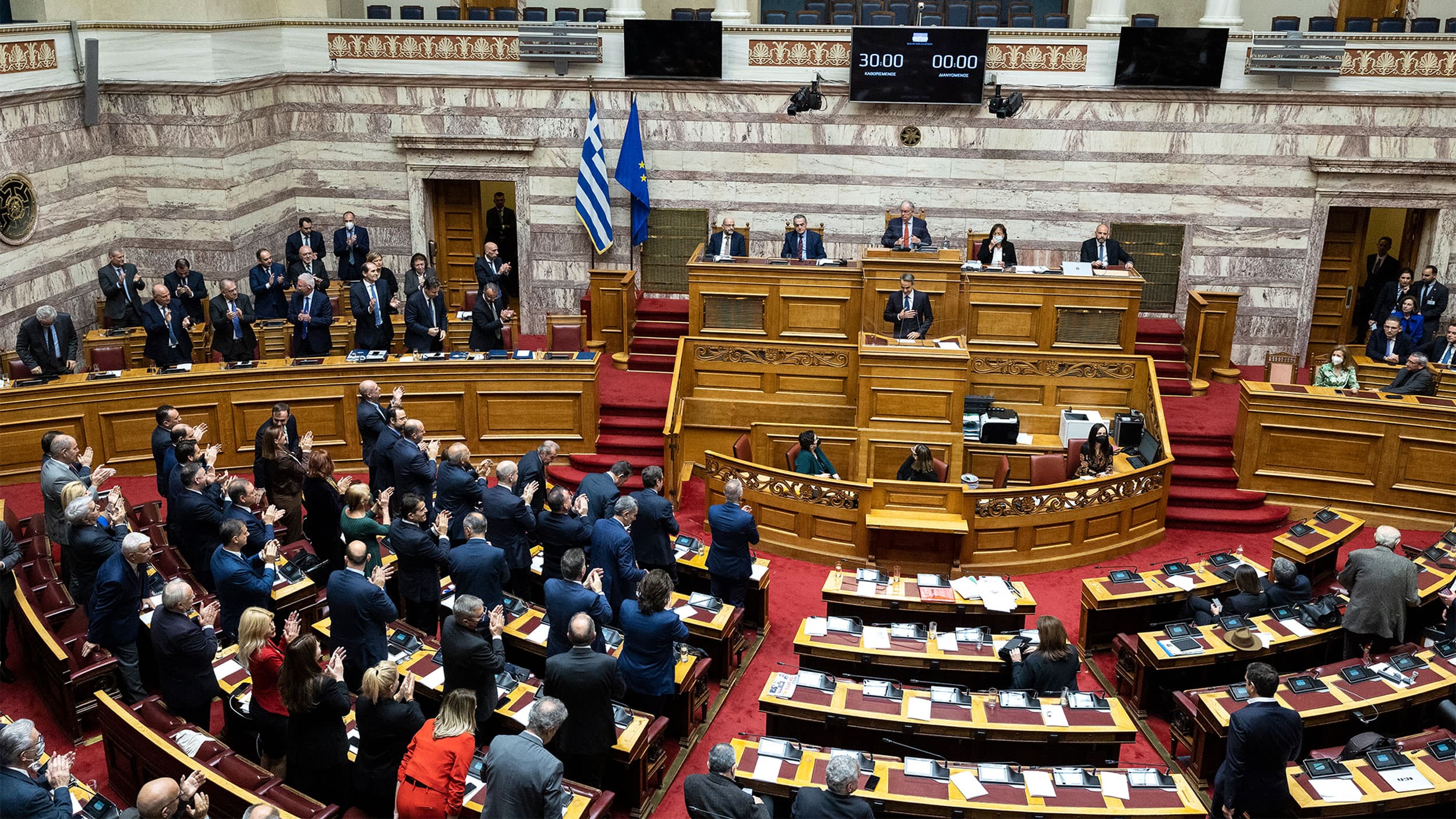 Greek Prime Minister Kyriakos Mitsotakis acknowledges applause from his lawmakers during a parliament session for the budget of 2023, in Athens, Dec. 17, 2022.