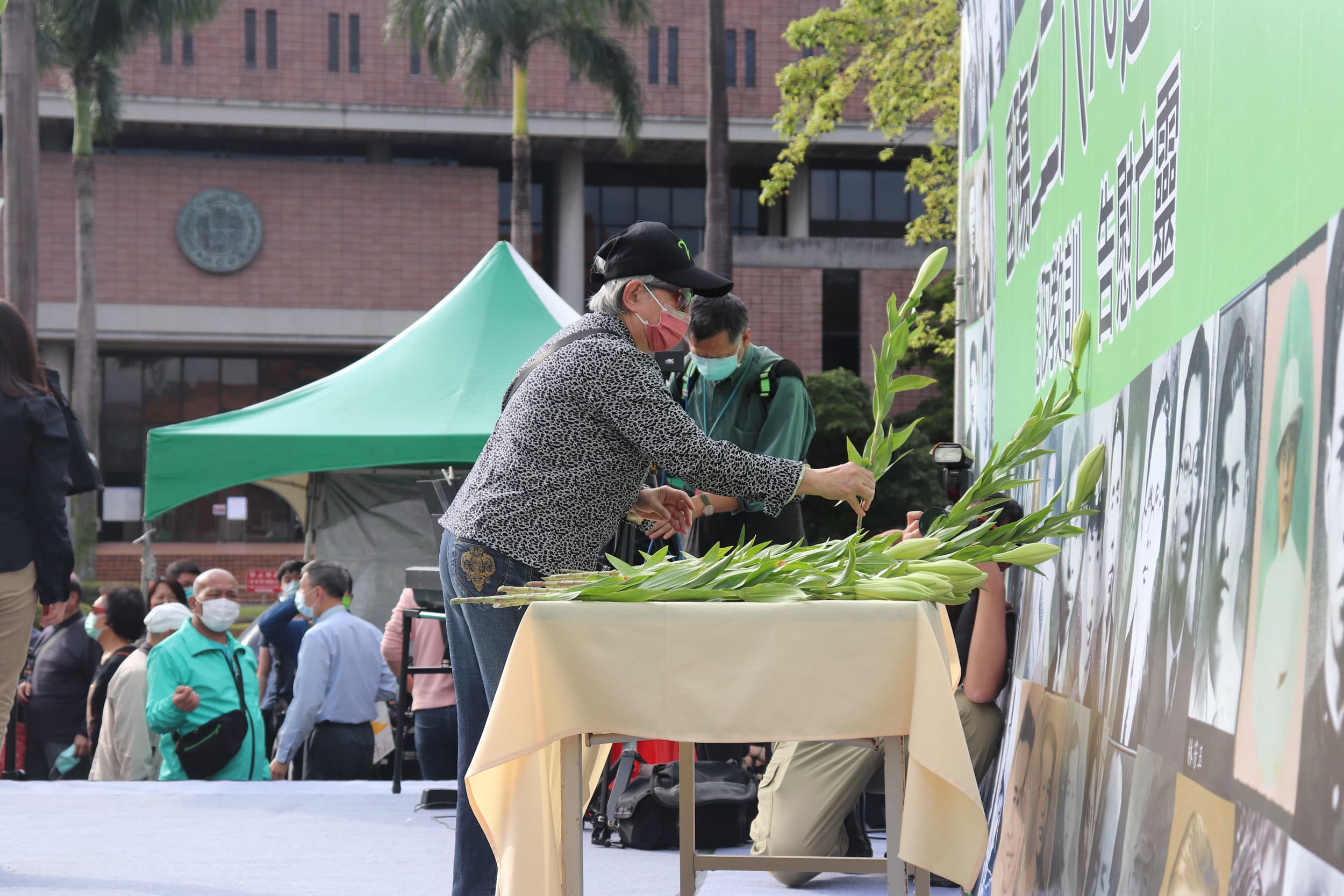 Attendees at a 228 memorial event lay water lilies, a symbol of Taiwanese democratic struggle, at an altar to victims of the massacre.