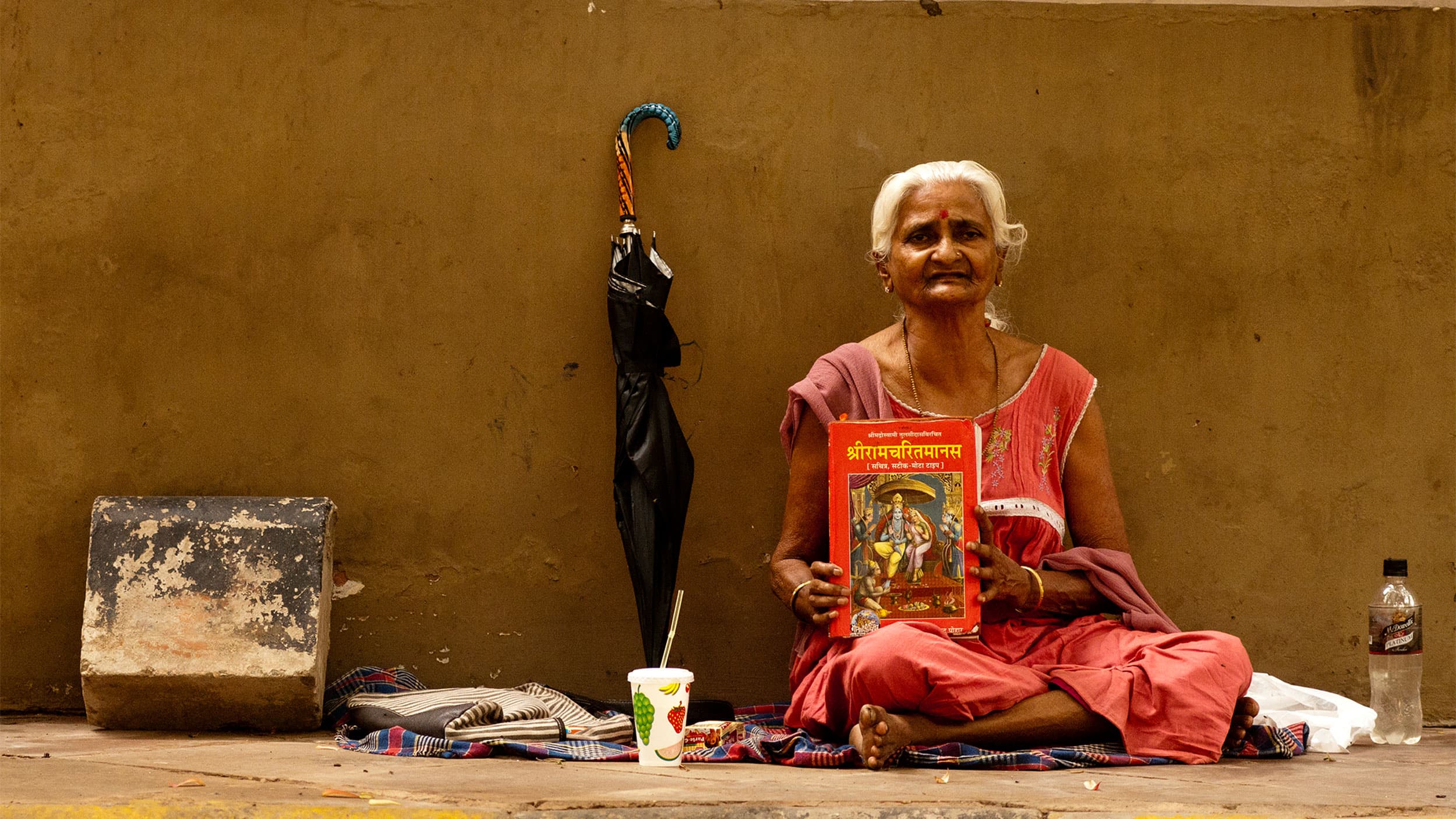 Ramrati reads Ramcharitmanas every morning on the lane that connects Barakhamba to KG Marg, in New Delhi, India, March 29, 2014.