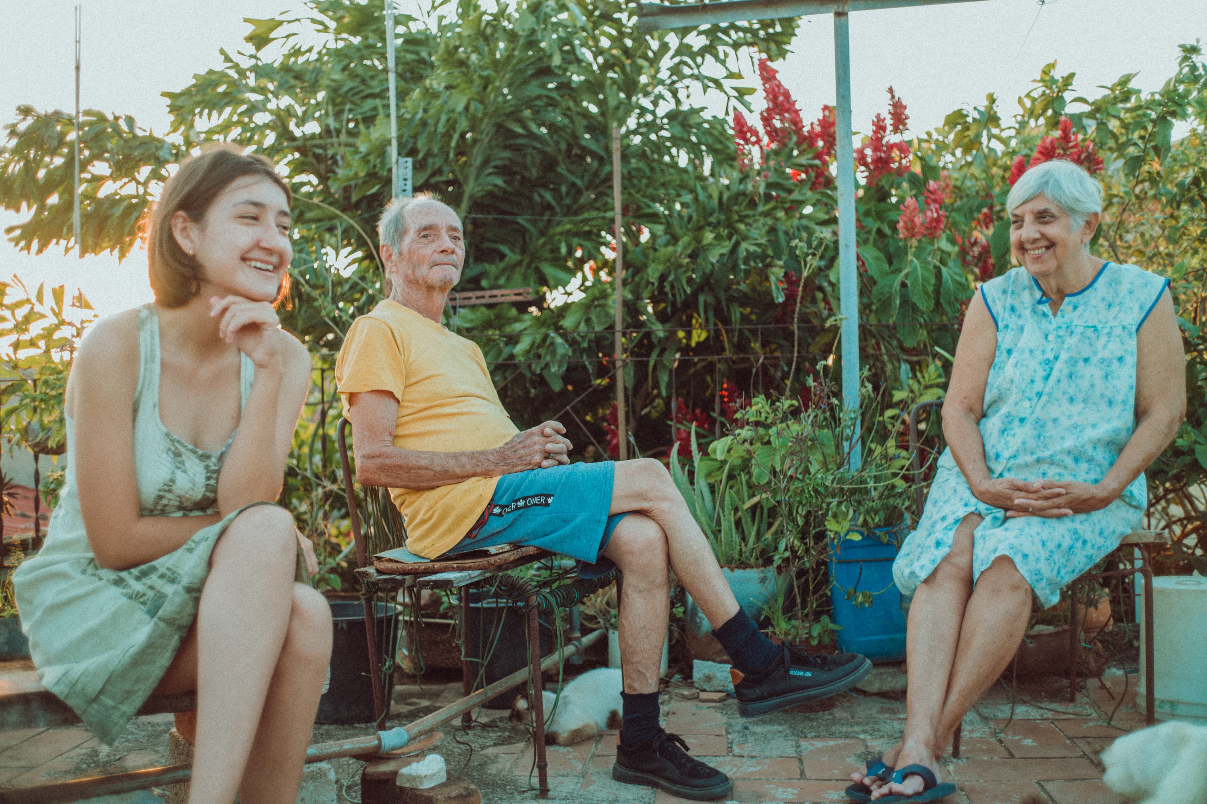 During a blackout affecting half the island, it's so hot the family climbs on the roof and hangs out, enjoying the breeze.