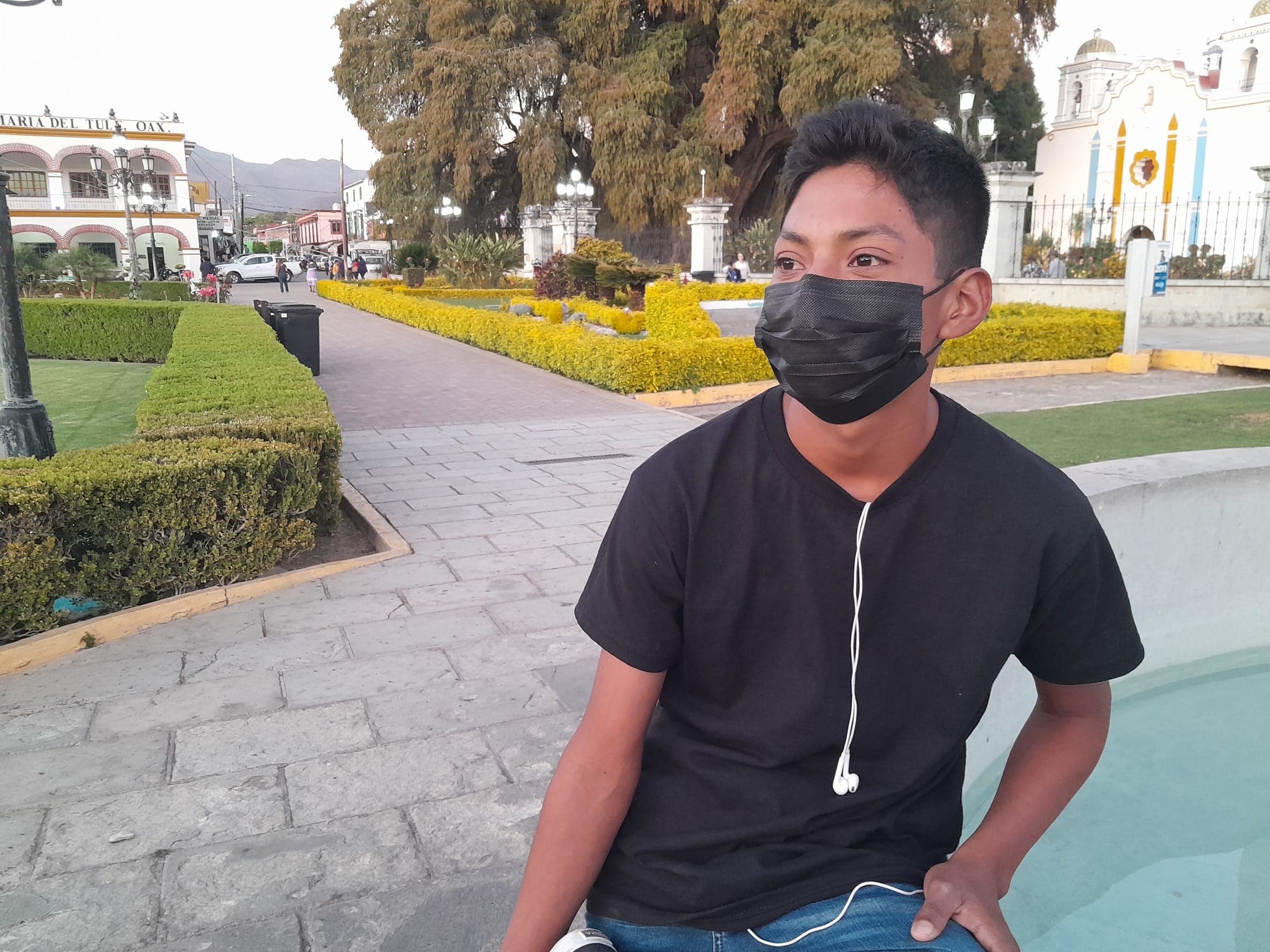 a young man in a mask