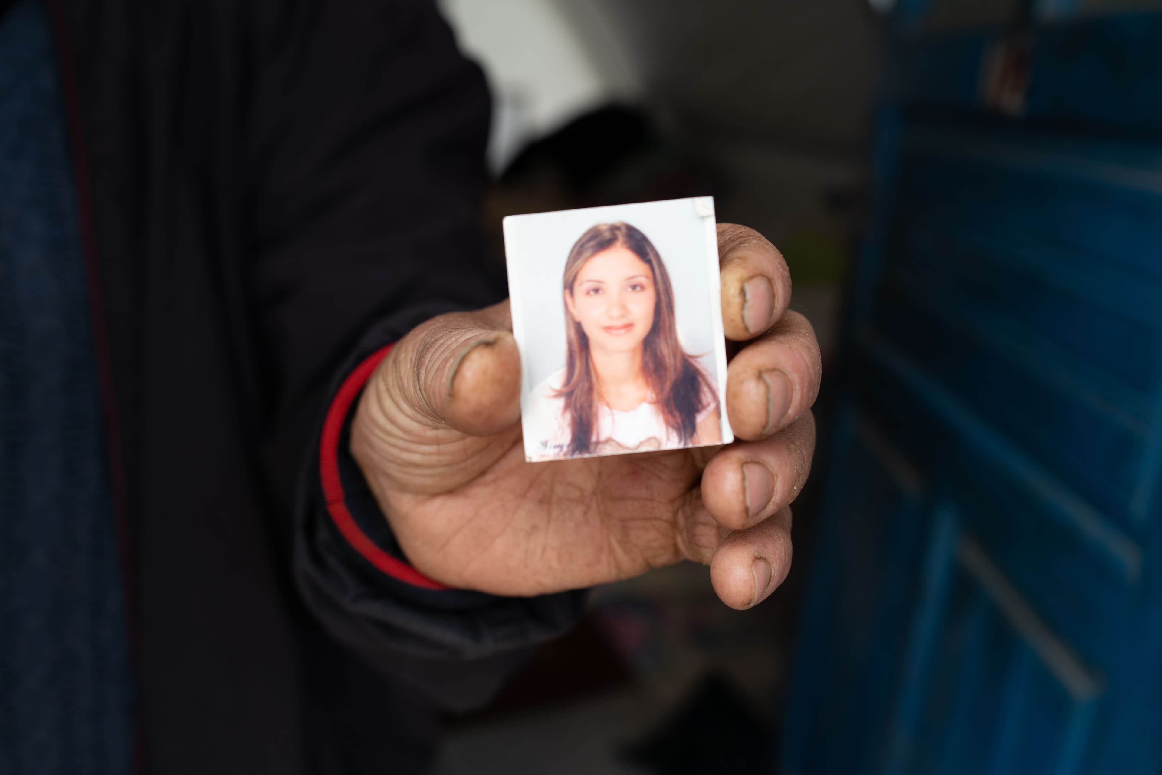 woman holding out photo