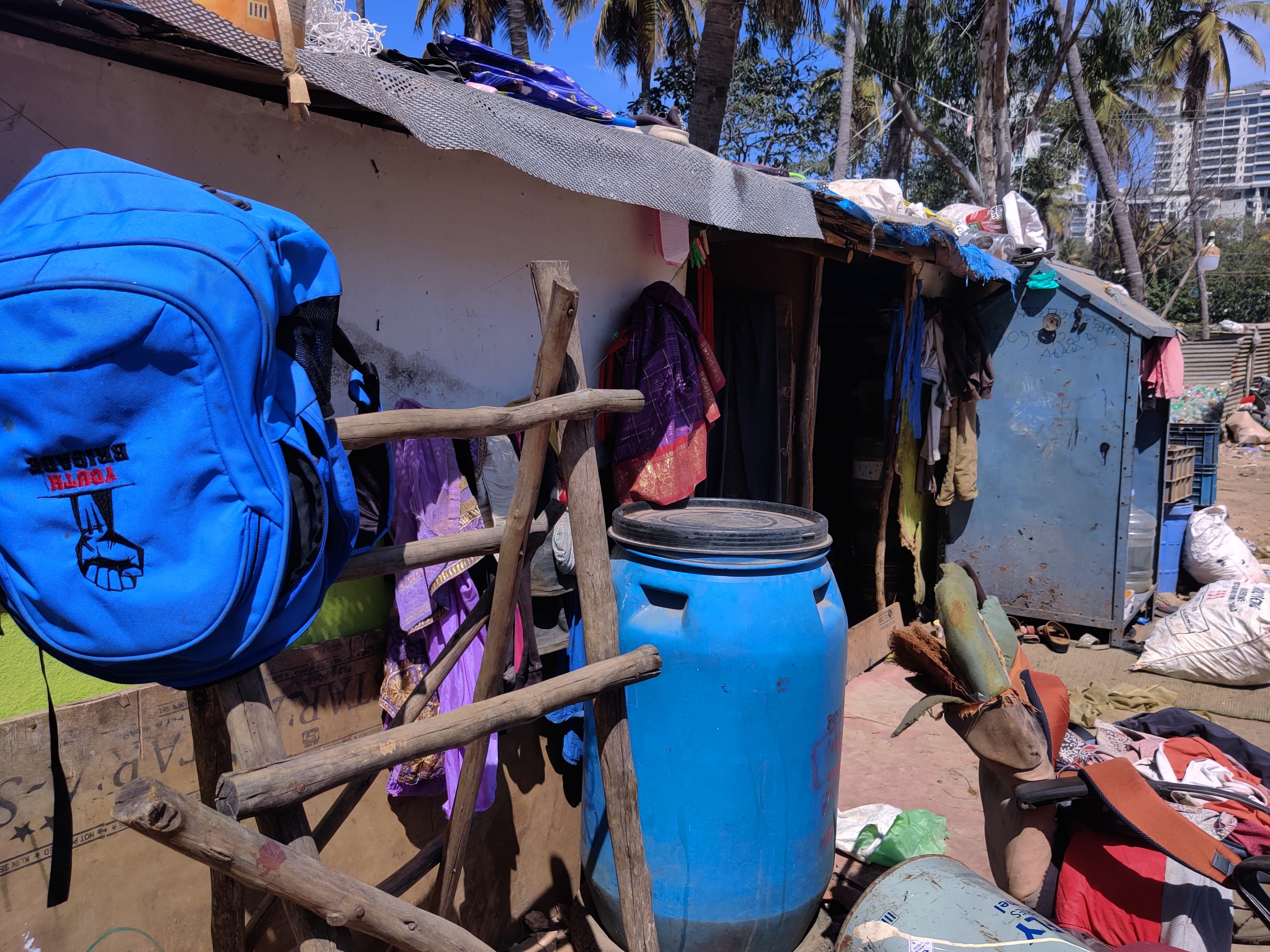 Homes in this informal settlement in Bangalore, India, are made of tin and plastic sheets.
