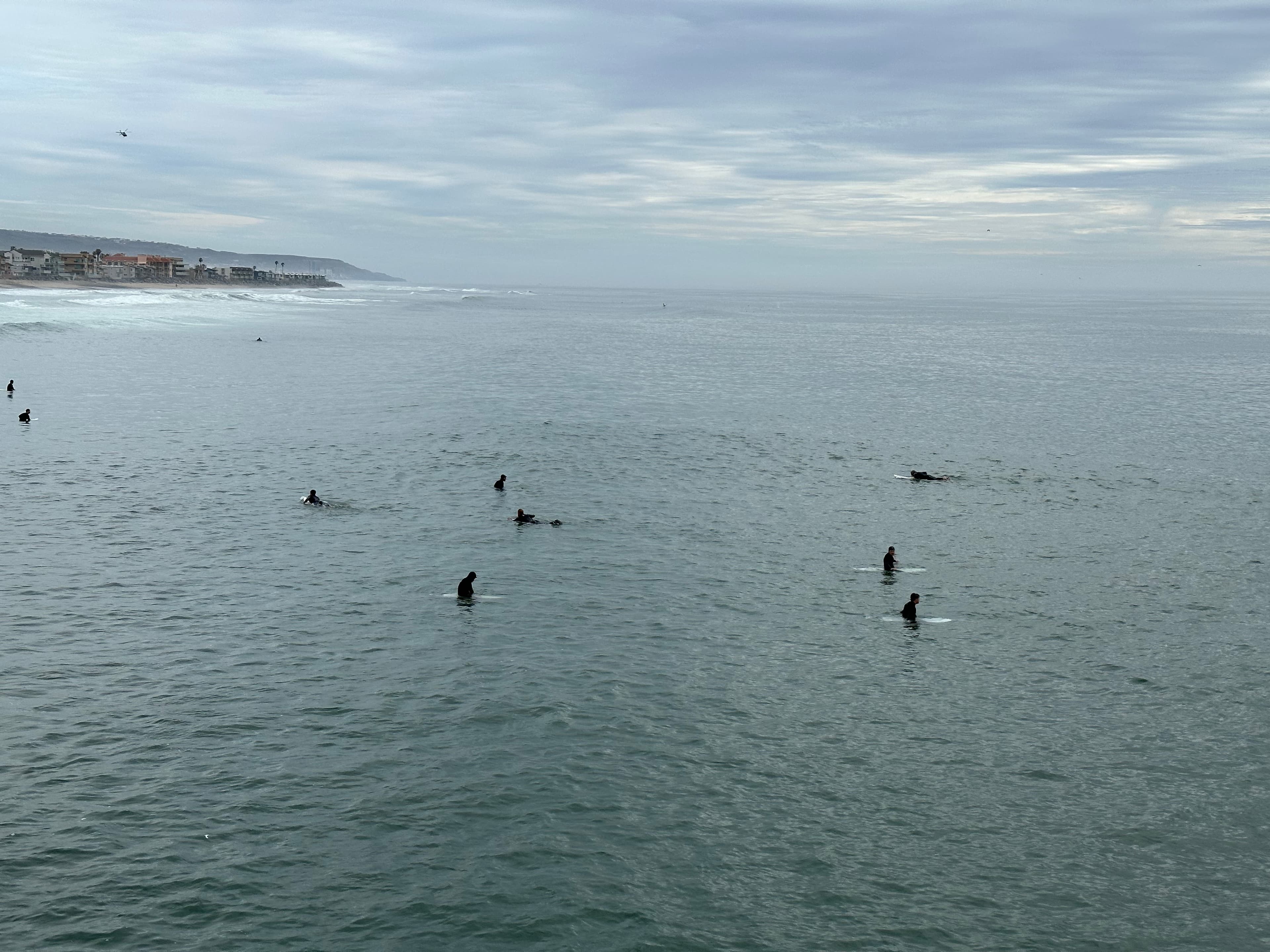 Surfers in the water at Imperial Beach, California