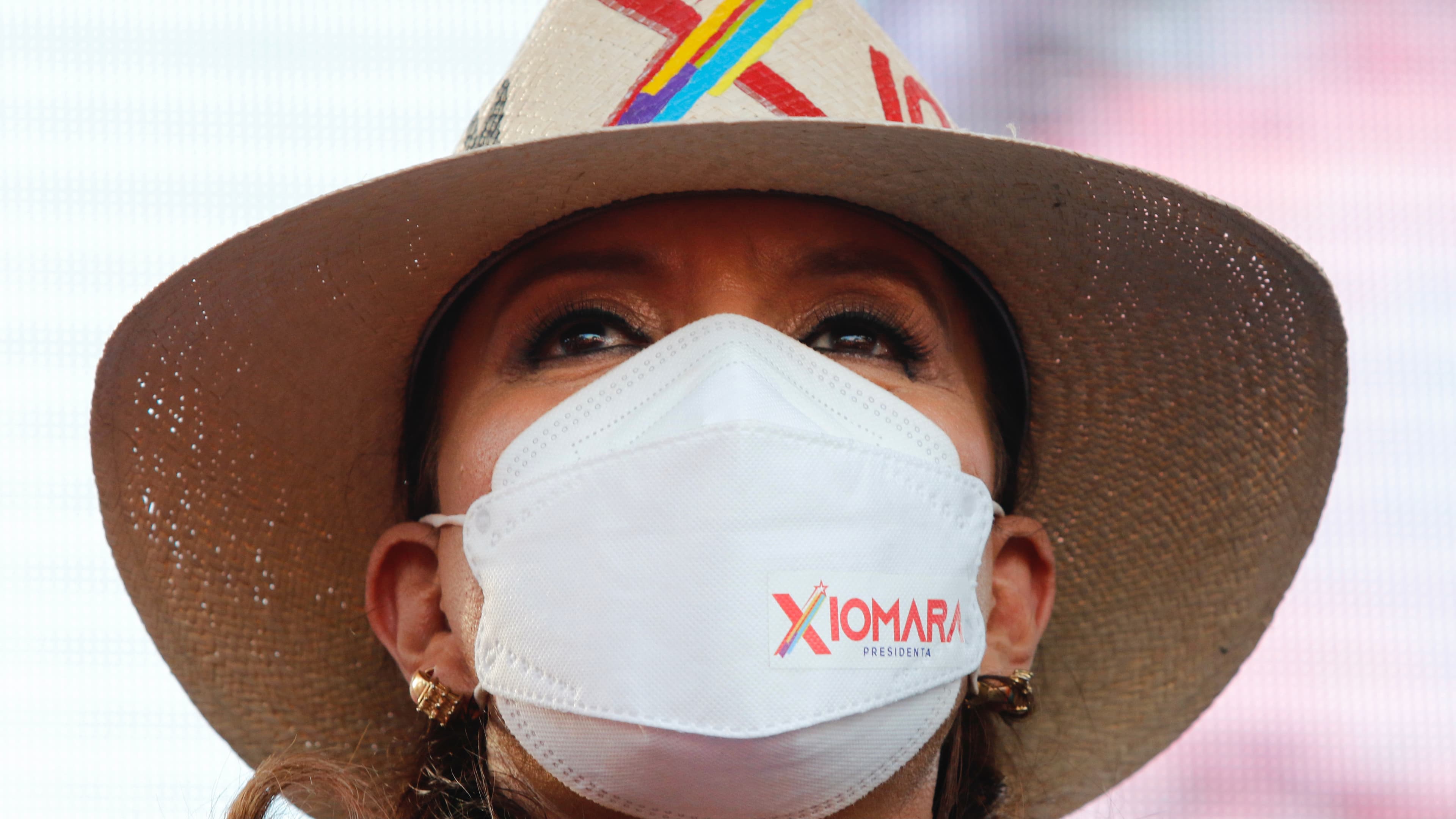 close-up shot of Honduran President Castro wearing a mask
