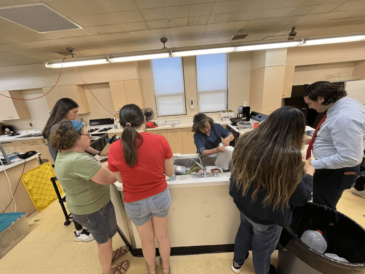 Students help chop vegetables to include in the bulgogi marinade.