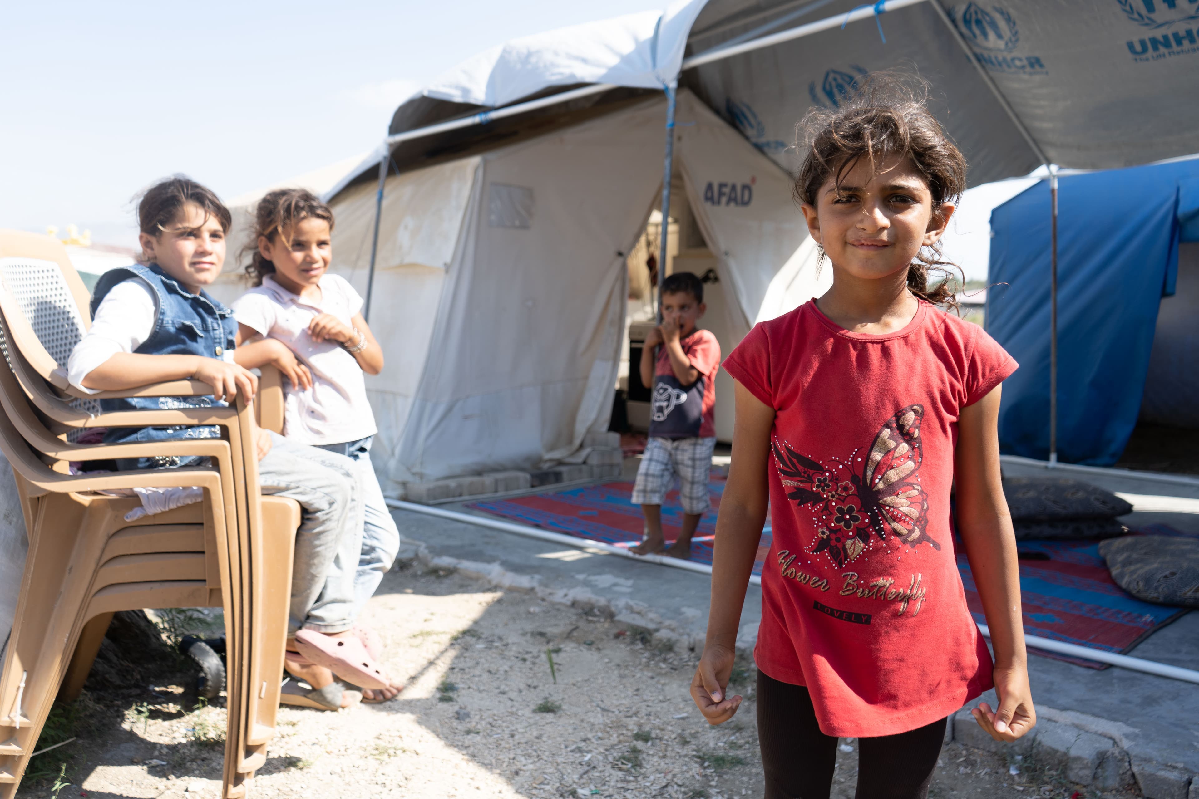Syrian children outside their tent in Antakya, Turkey. Many Syrian families who lost their homes in the earthquake are living in tents.