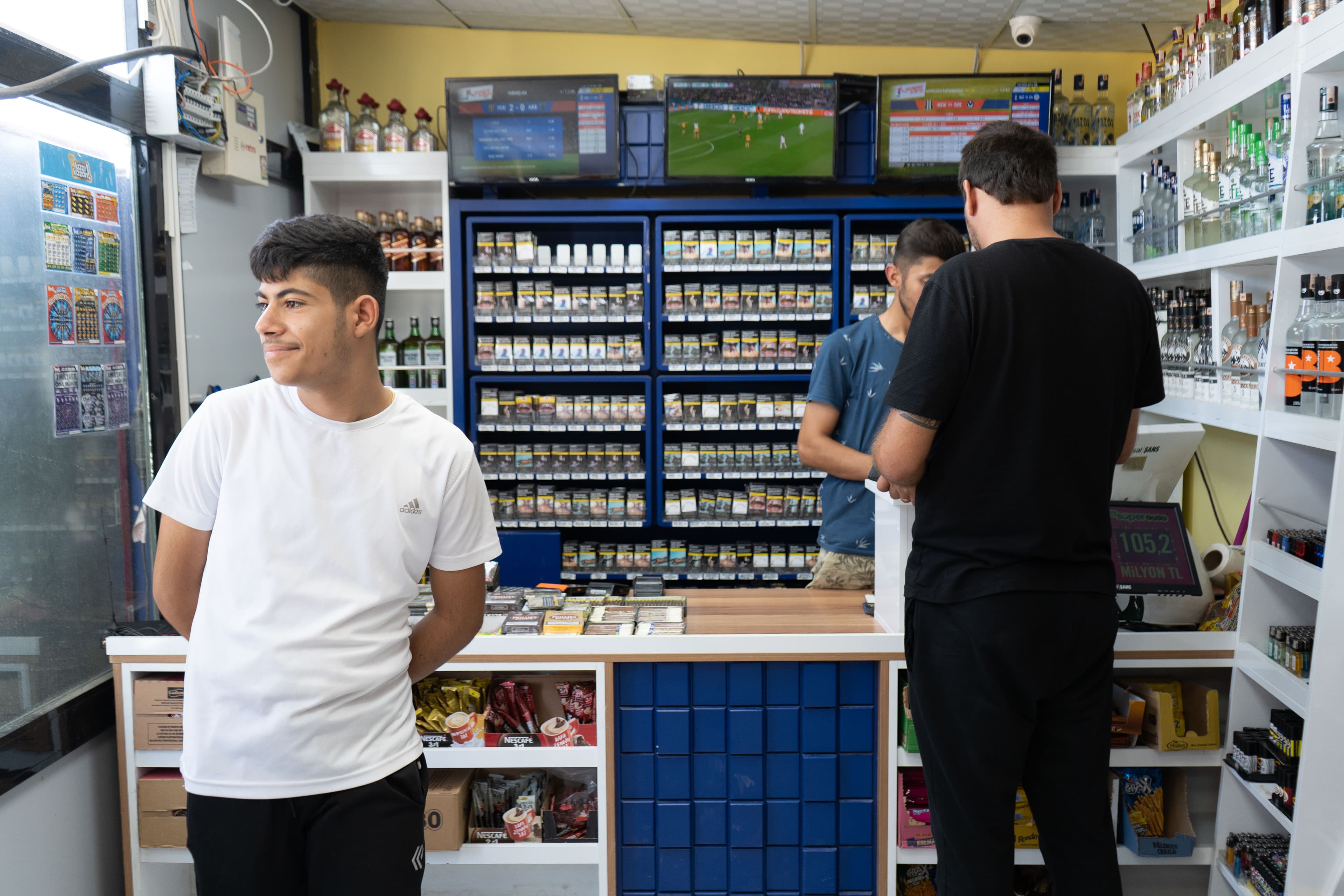 Many shops have reopened for business in converted shipping containers, like this liquor store.