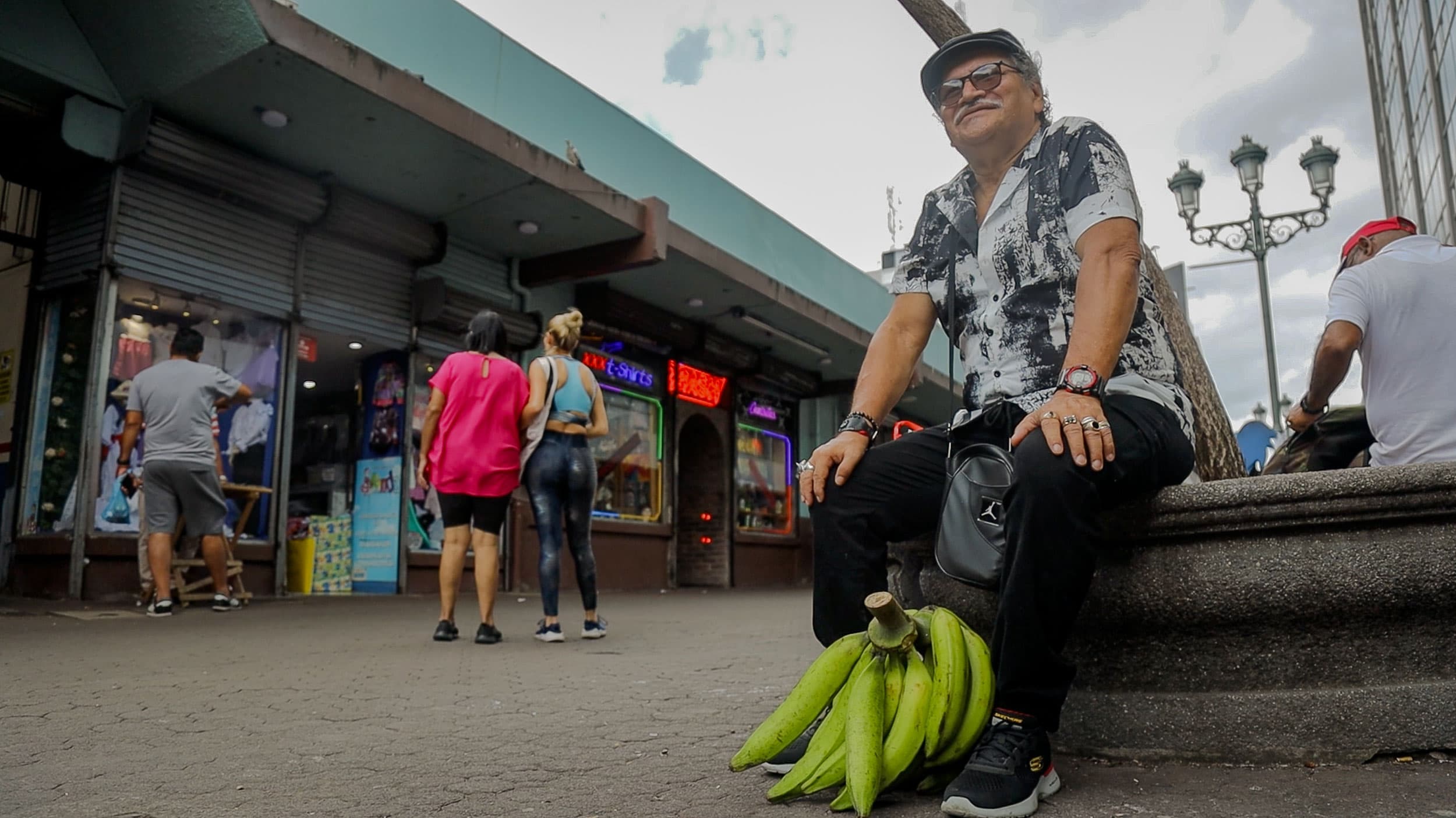 Eduardo Alvarado sits on a ledge in downtown San Jose