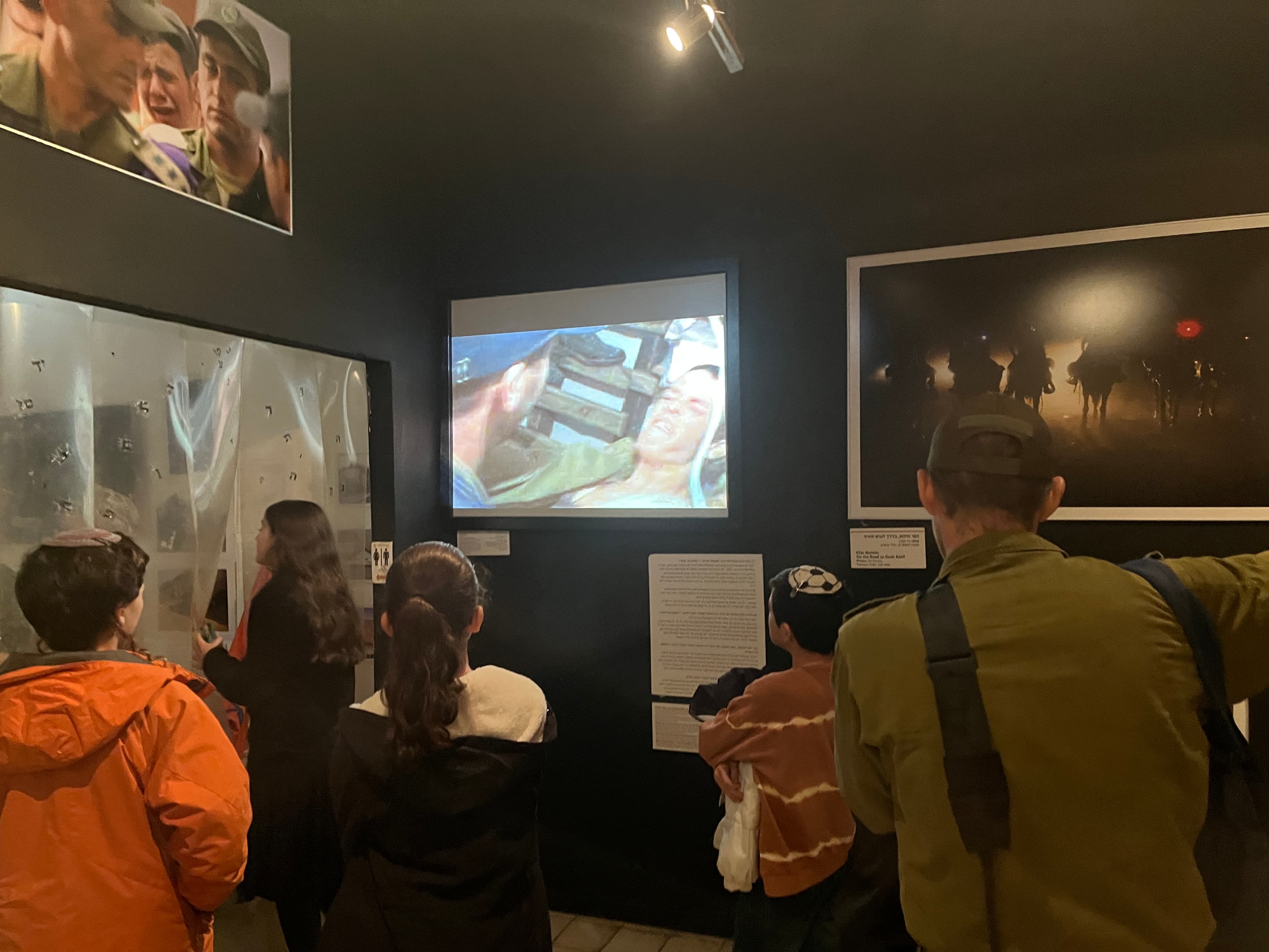 People crowded into a museum showcase room