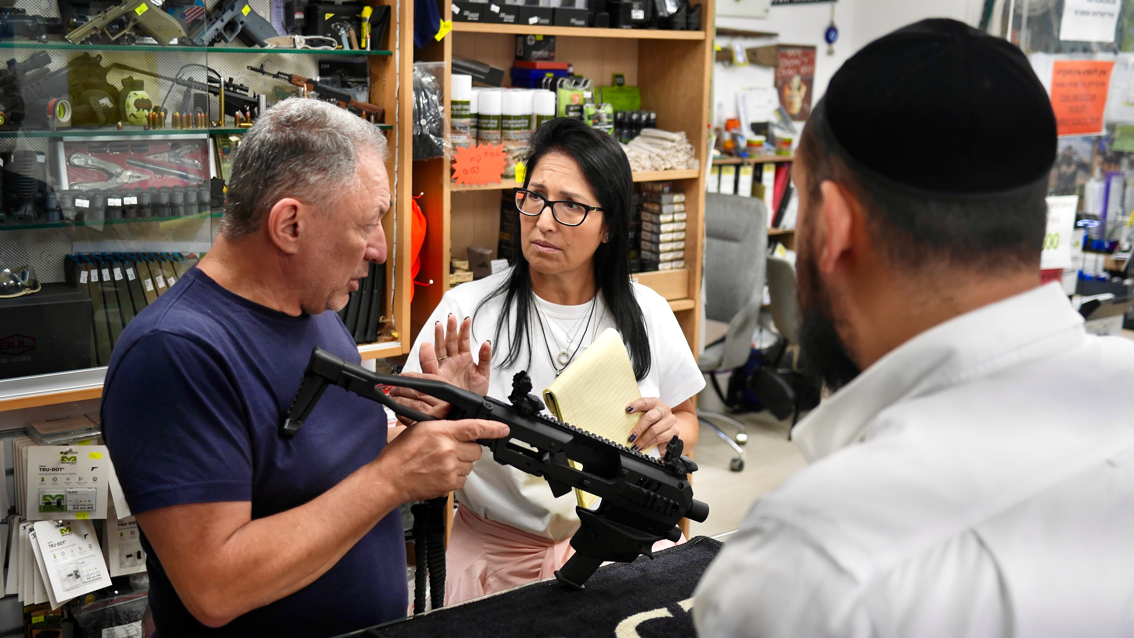Customers come to the gun shop to sign up for gun safety courses, shooting range practice, and to purchase guns.