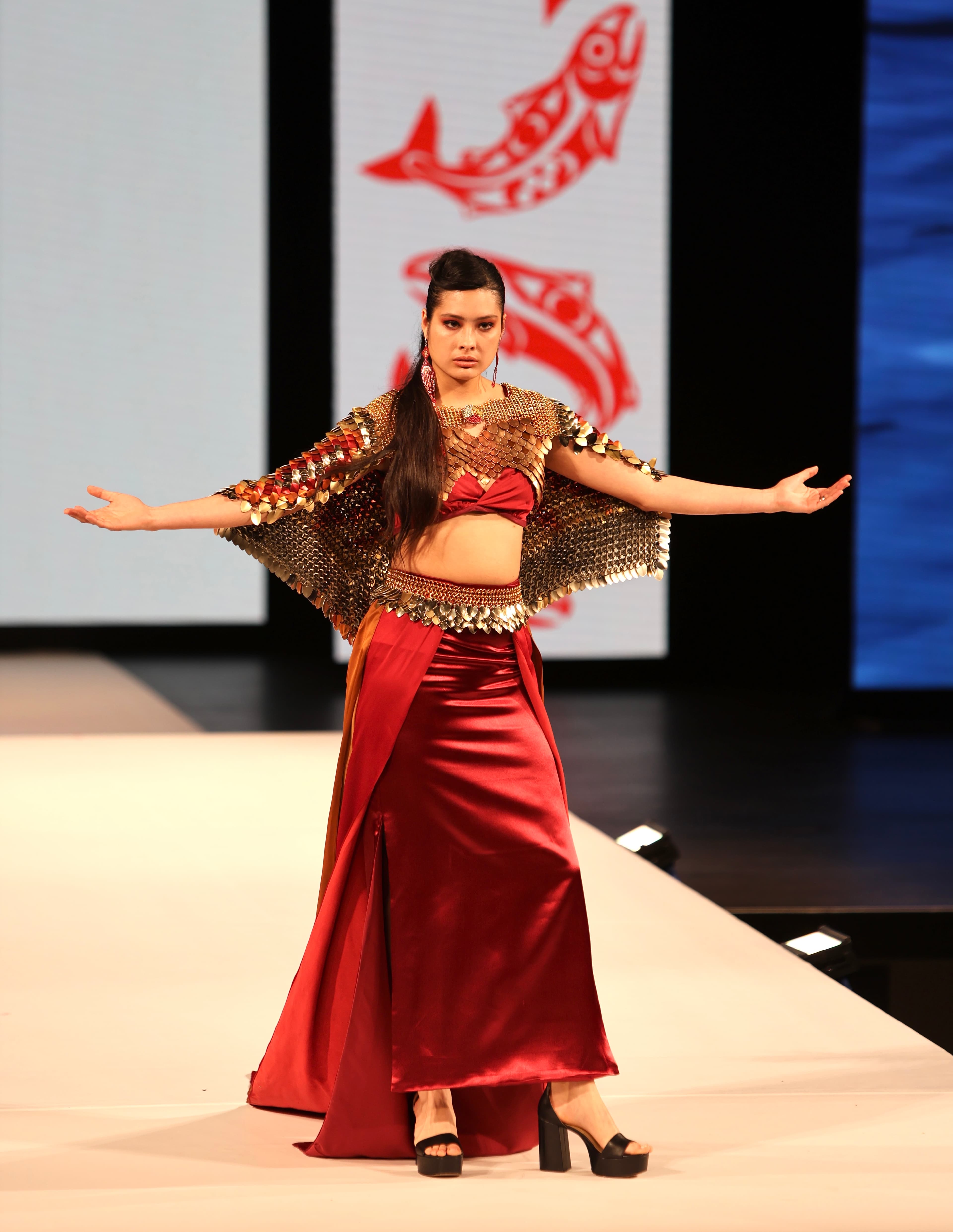 Alicia Hanton walks the runway during the opening Red Dress night in a gown by Yolonda Skelton, a Gitxsan designer based in Vancouver.