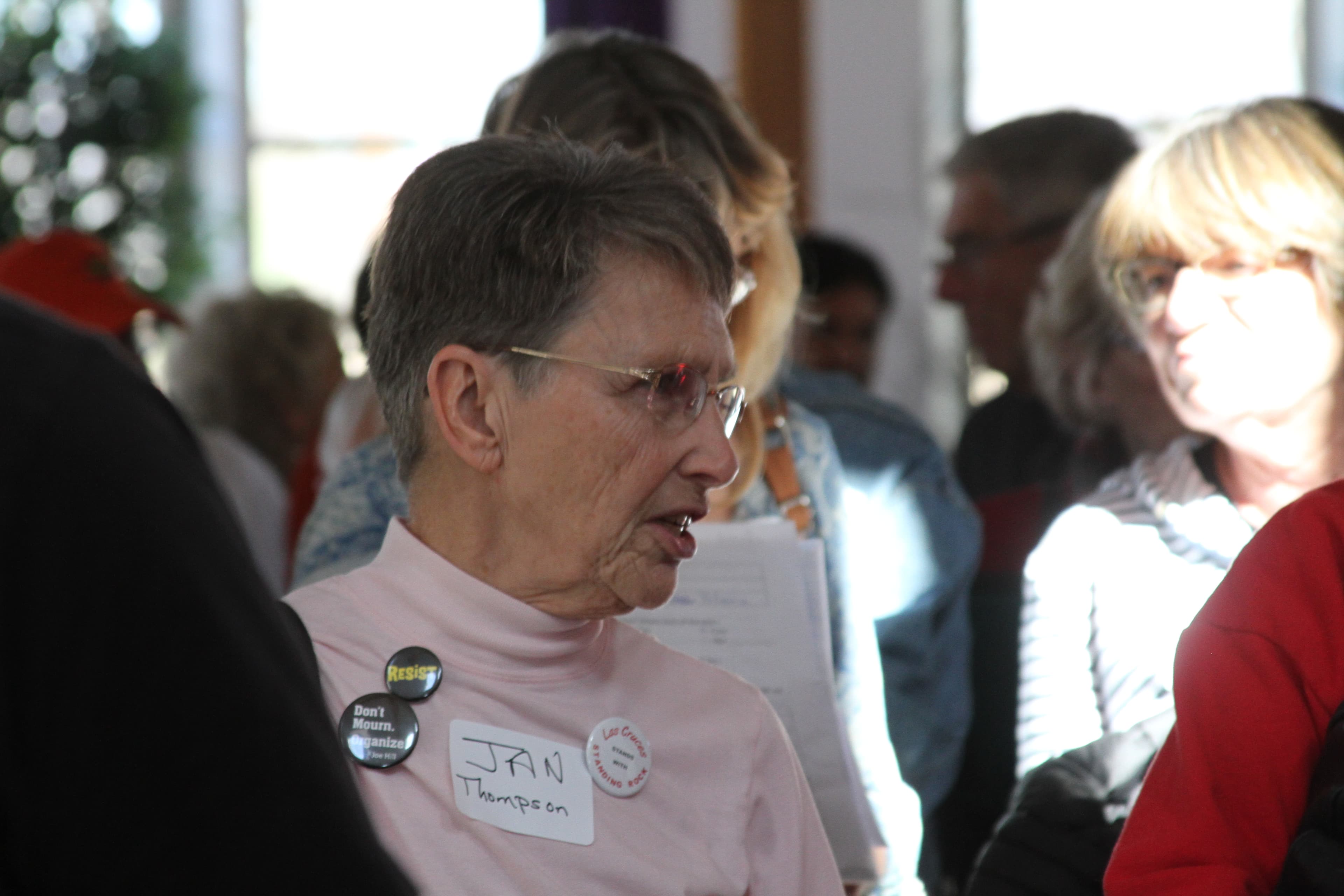 Woman with nametag in crowd