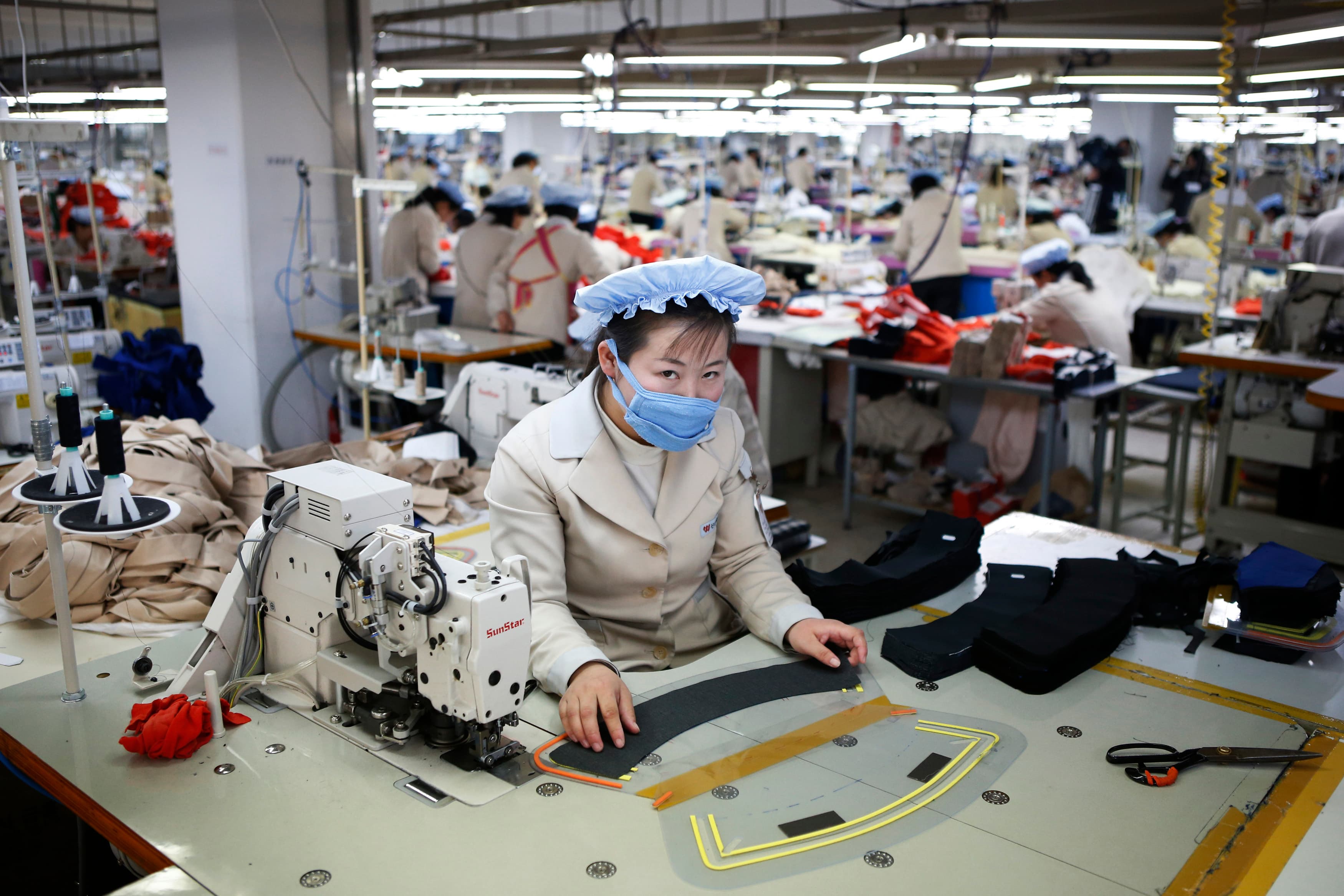 A North Korean employee works in the factory of a South Korean company at the Joint Industrial Park in the Kaesong industrial zone, a few miles inside North Korea from the heavily fortified border, Dec. 19, 2013.