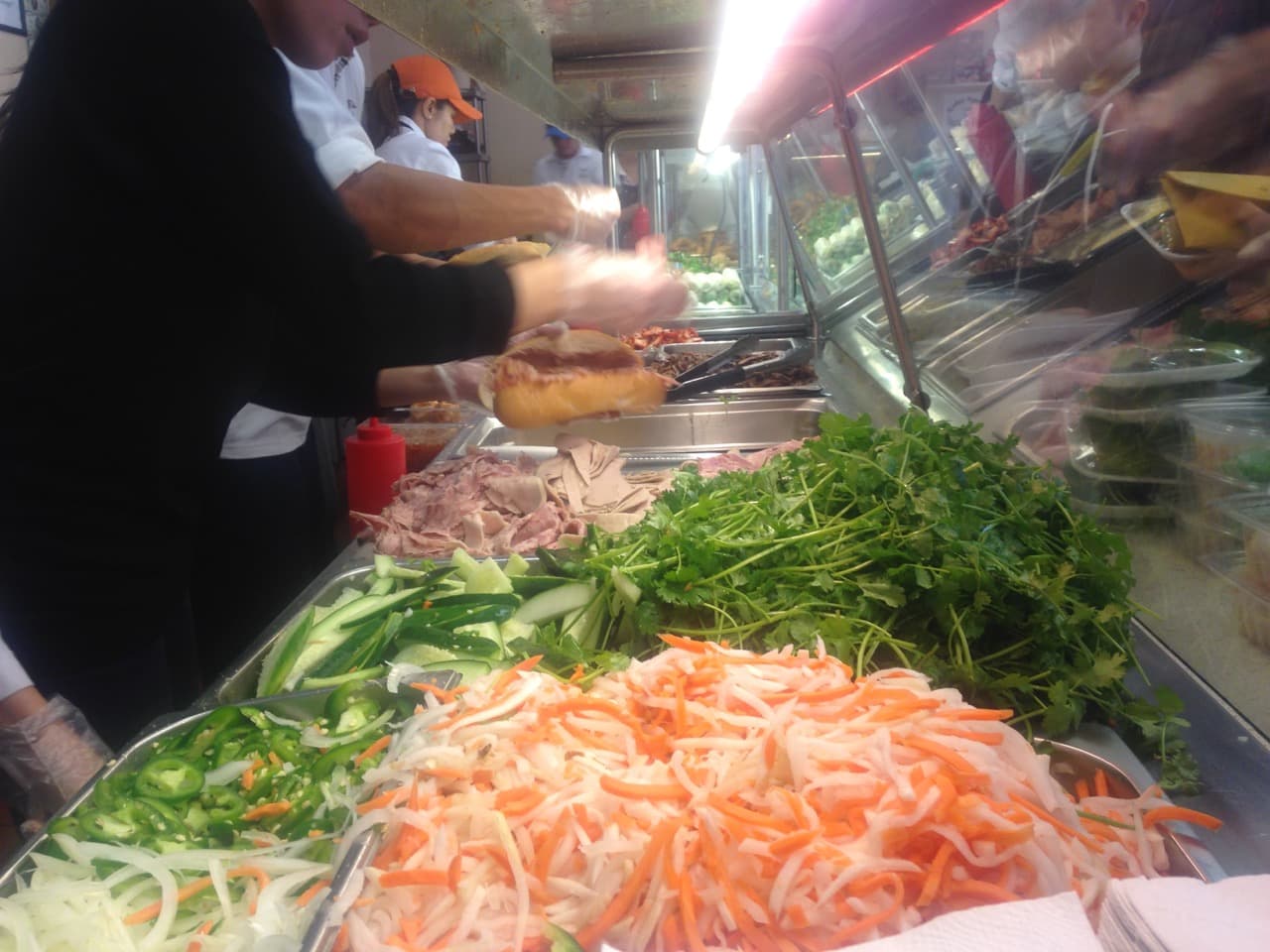 Building the perfect Banh Mi sandwich at Banh Mi Ba Le.