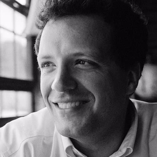 black and white photo of man smiling