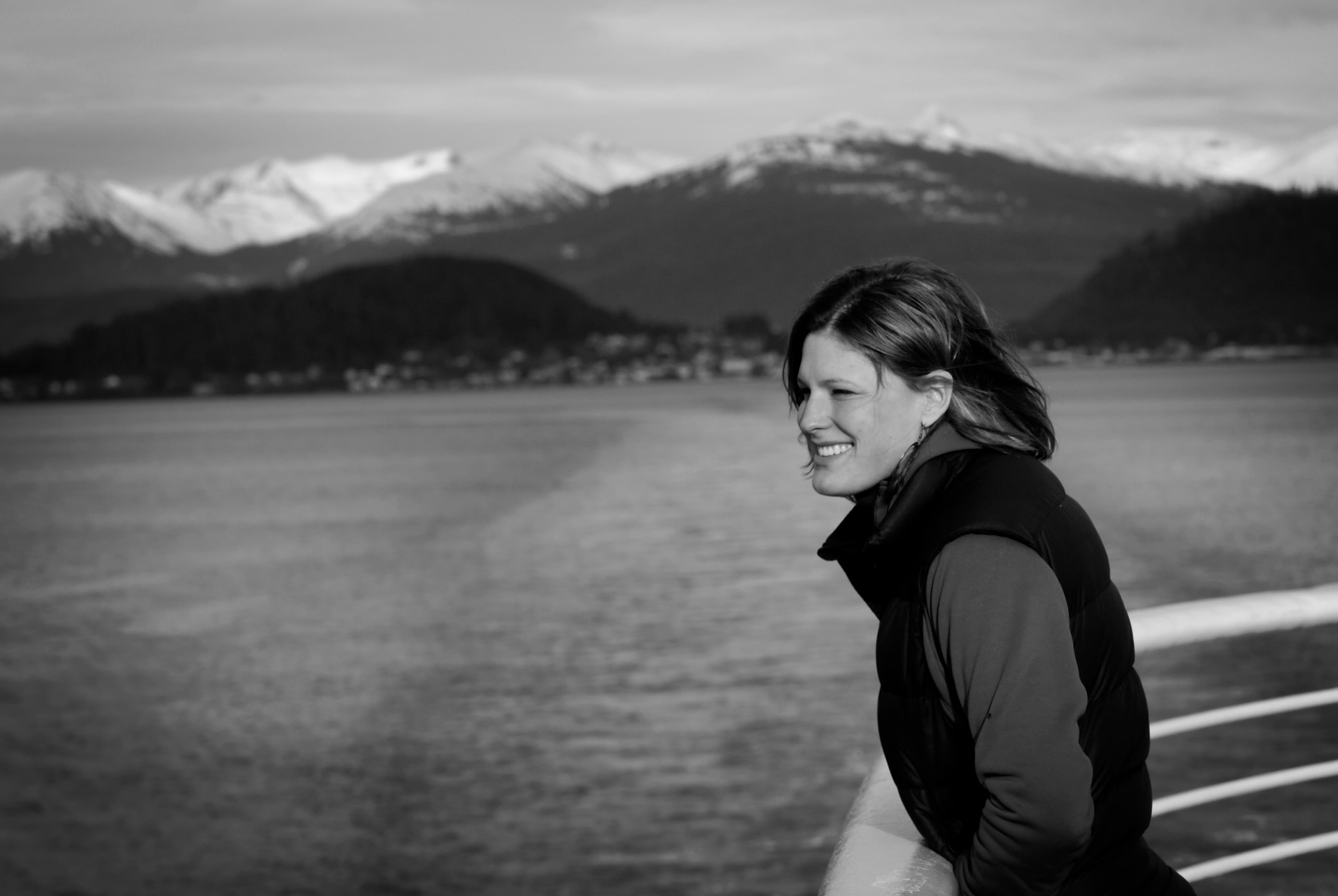 Black and white photo of woman looking in distance