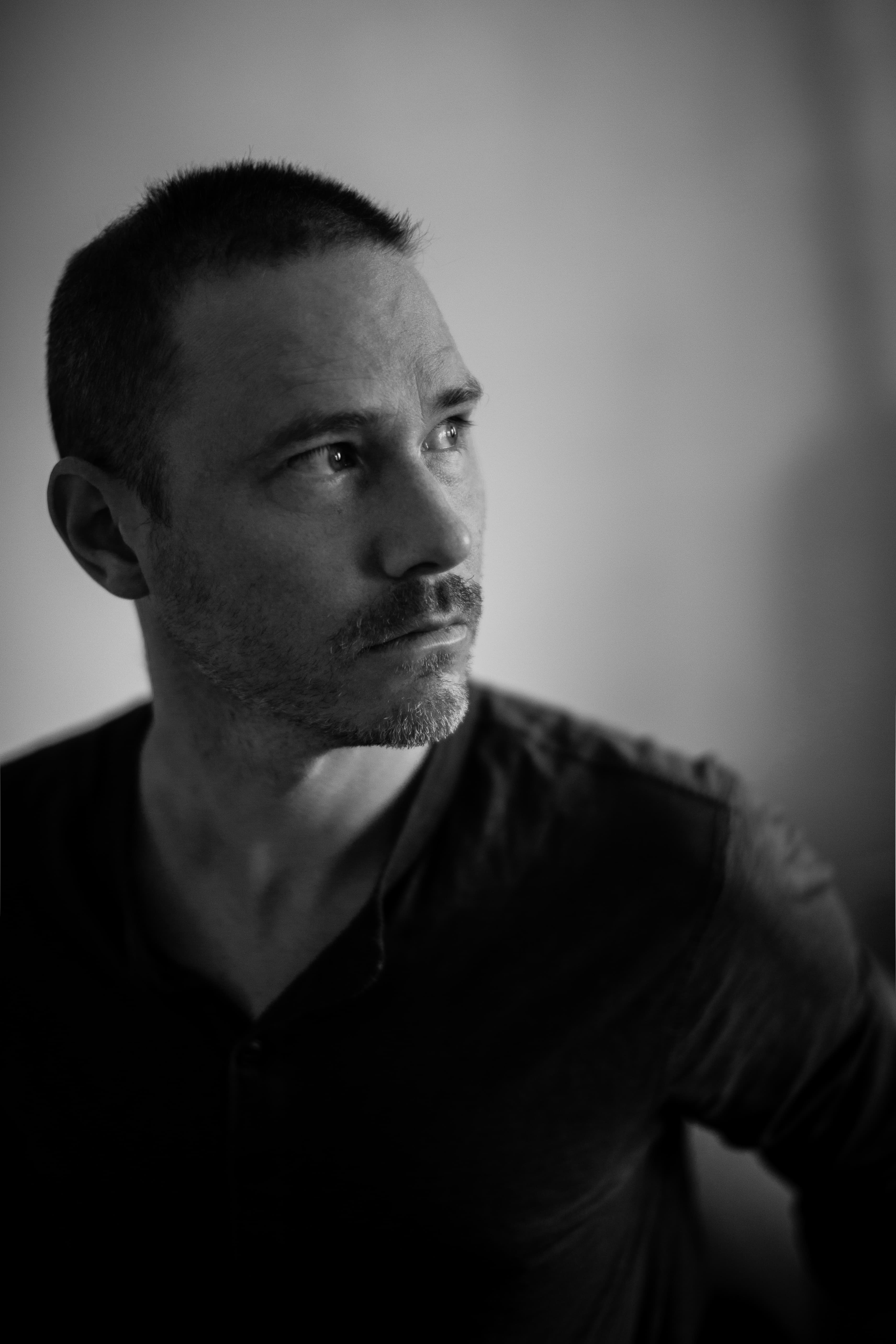 Black and white portrait of man, looking to side