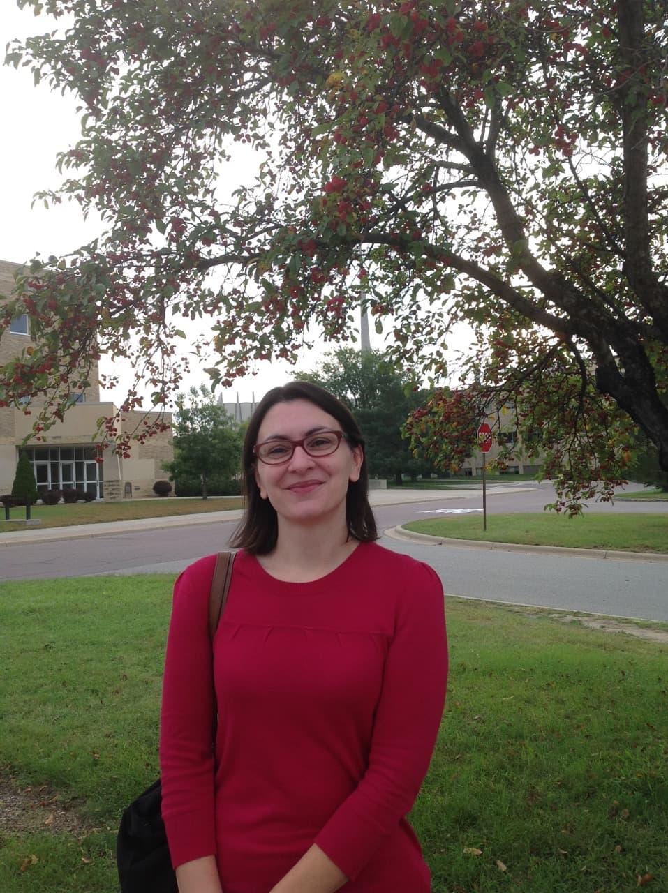 Woman standing, smiling
