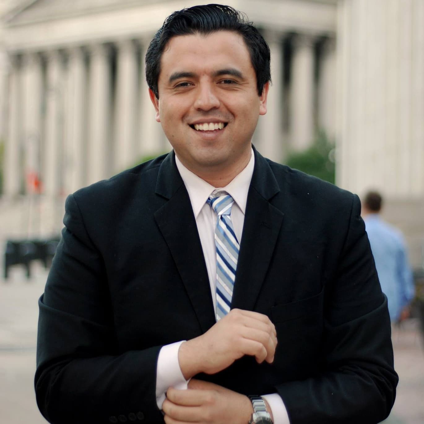 Man in suit jacket posing for camera