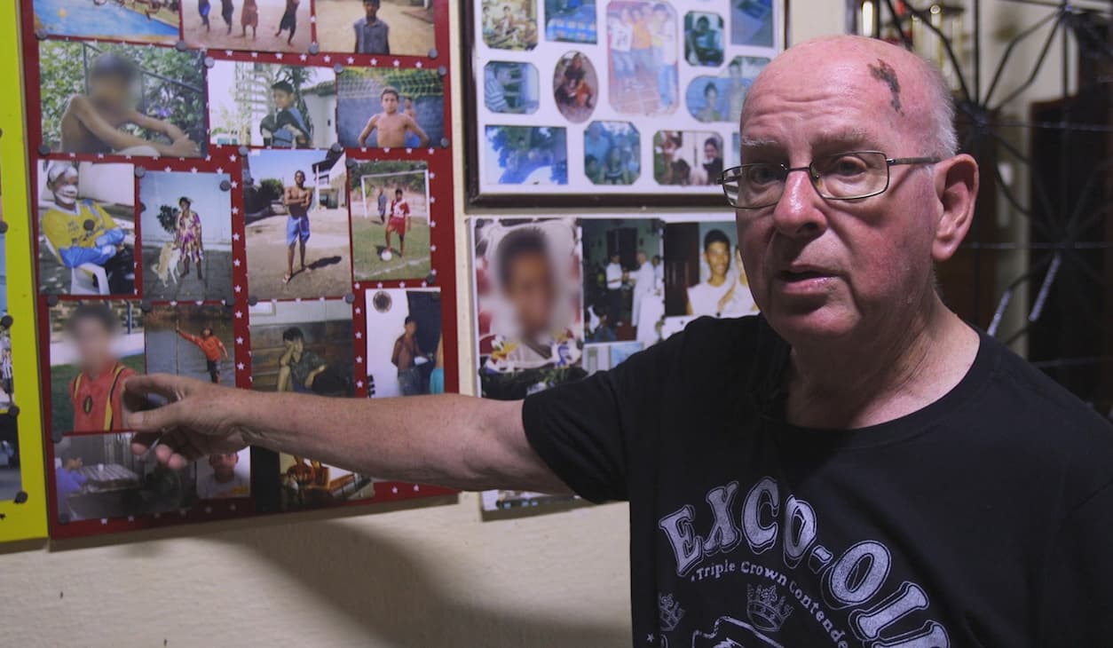 Father Jan Van Dael and photos of boys