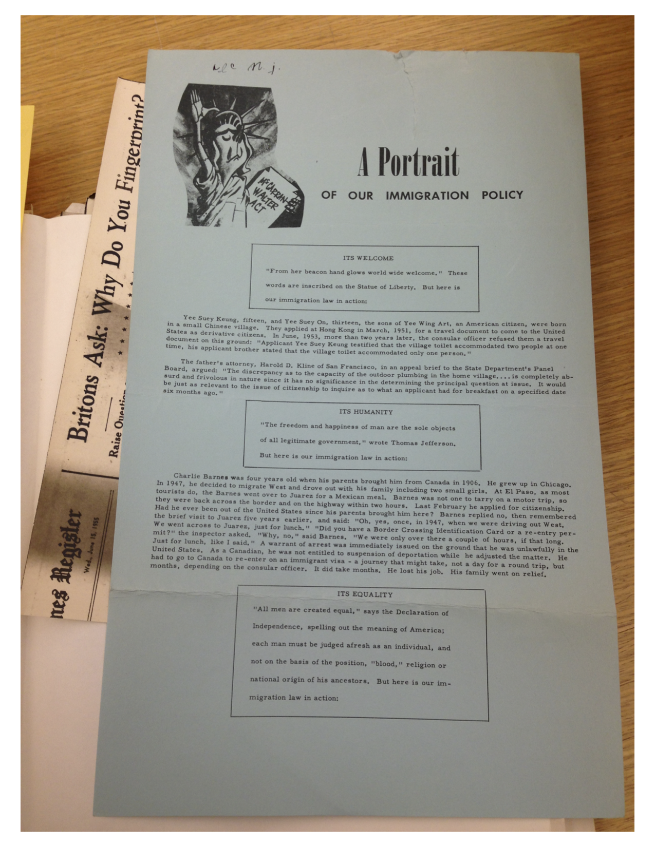 Activists material about immigration laws, with a cartoon of the Statue of Liberty