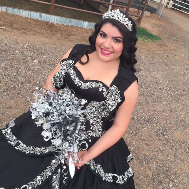 Kimberly's charro, or elegant-cowboy themed party, means that every last detail includes references to horses — even her bouquet has a horseshoe in it.