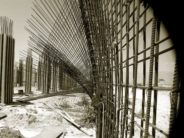Tilted columns and sagging reinforcing rods at the Justice Center Court House construction project in Parwan Province, Afghanistan.