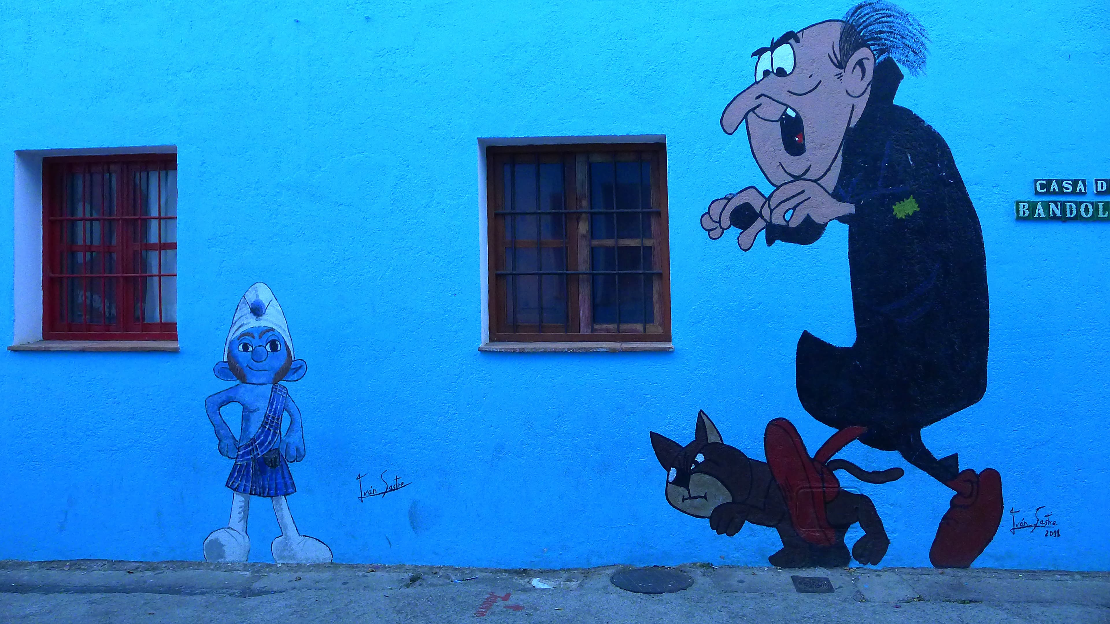 Smurf characters adorn many of the walls in Juzcar. Tourists come from around the world to see the world's first ever "Official Smurf Village."