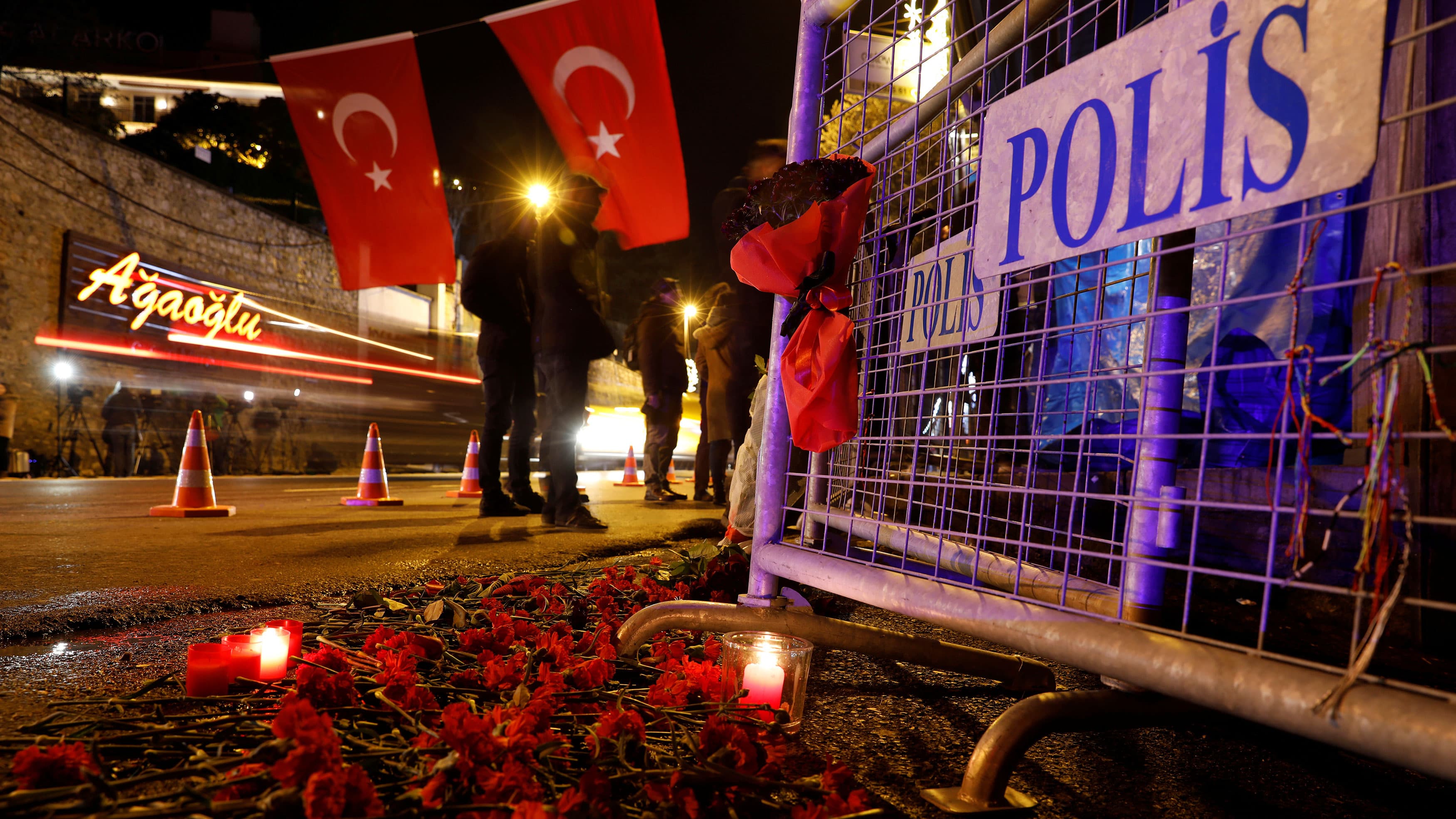 Police have erected barricades and mourners have left flowers outside Reina, the nightclub in Istabul where 39 died during a terrorist attack.