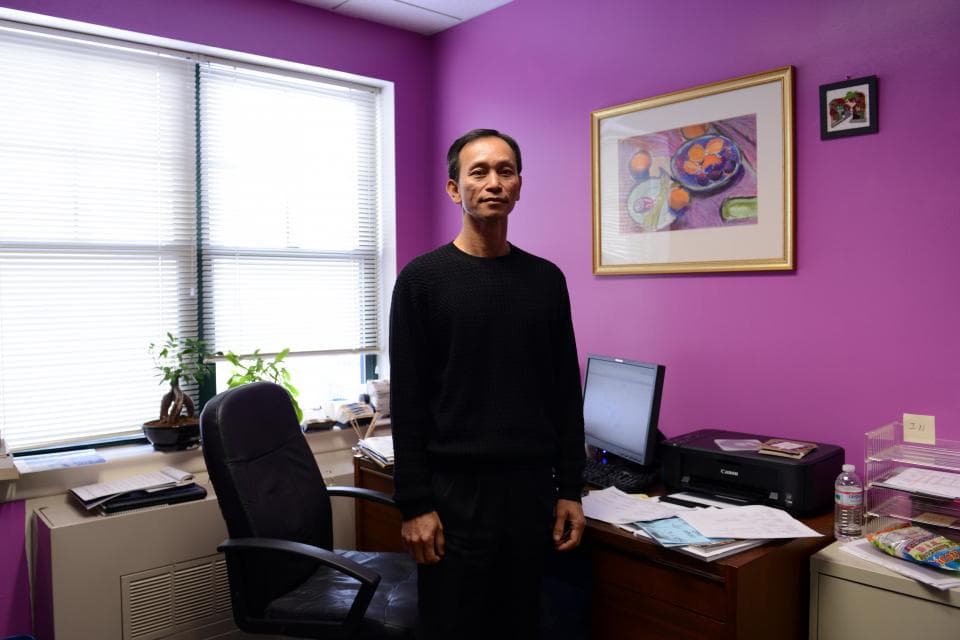 Man standing in front of desk