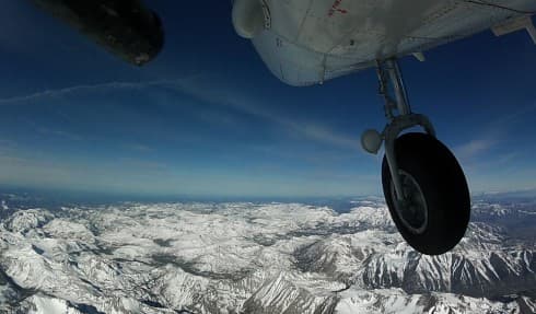 NASA's Airborne Snow Observatory flies above the Sierra Nevada mountain range in California.