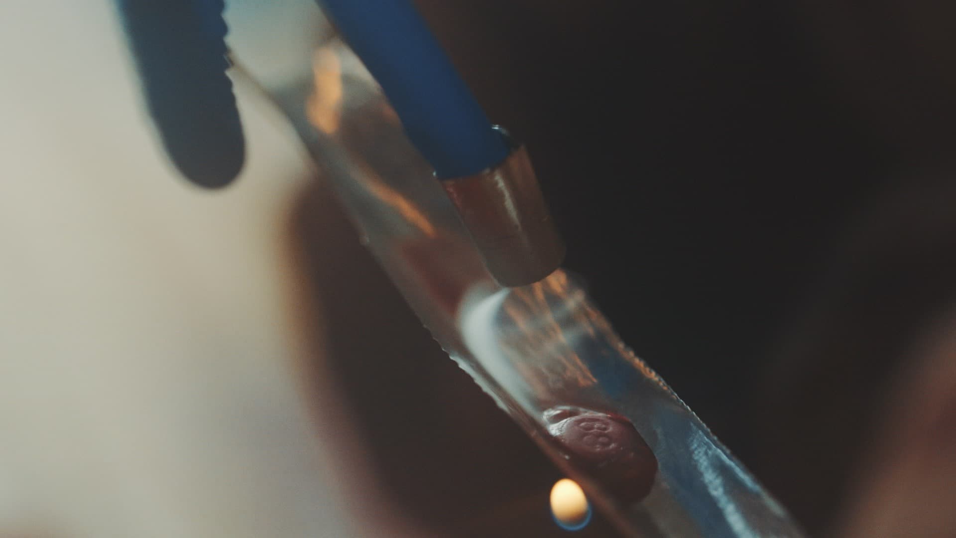Smoke from a pink methamphetamine pill, heated on foil, rises into a water bong pipe in Myitkyina, Myanmar. Meth pills branded with the number "88" are believed to signify 1988, a celebrated year in which a popular uprising tried to oust Myanmar's hated m