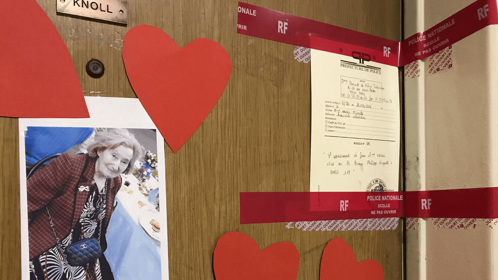 Red police tape and a photograph are seen on the front door of the appartment of Mireille Knoll in Paris, France, March 27, 2018.